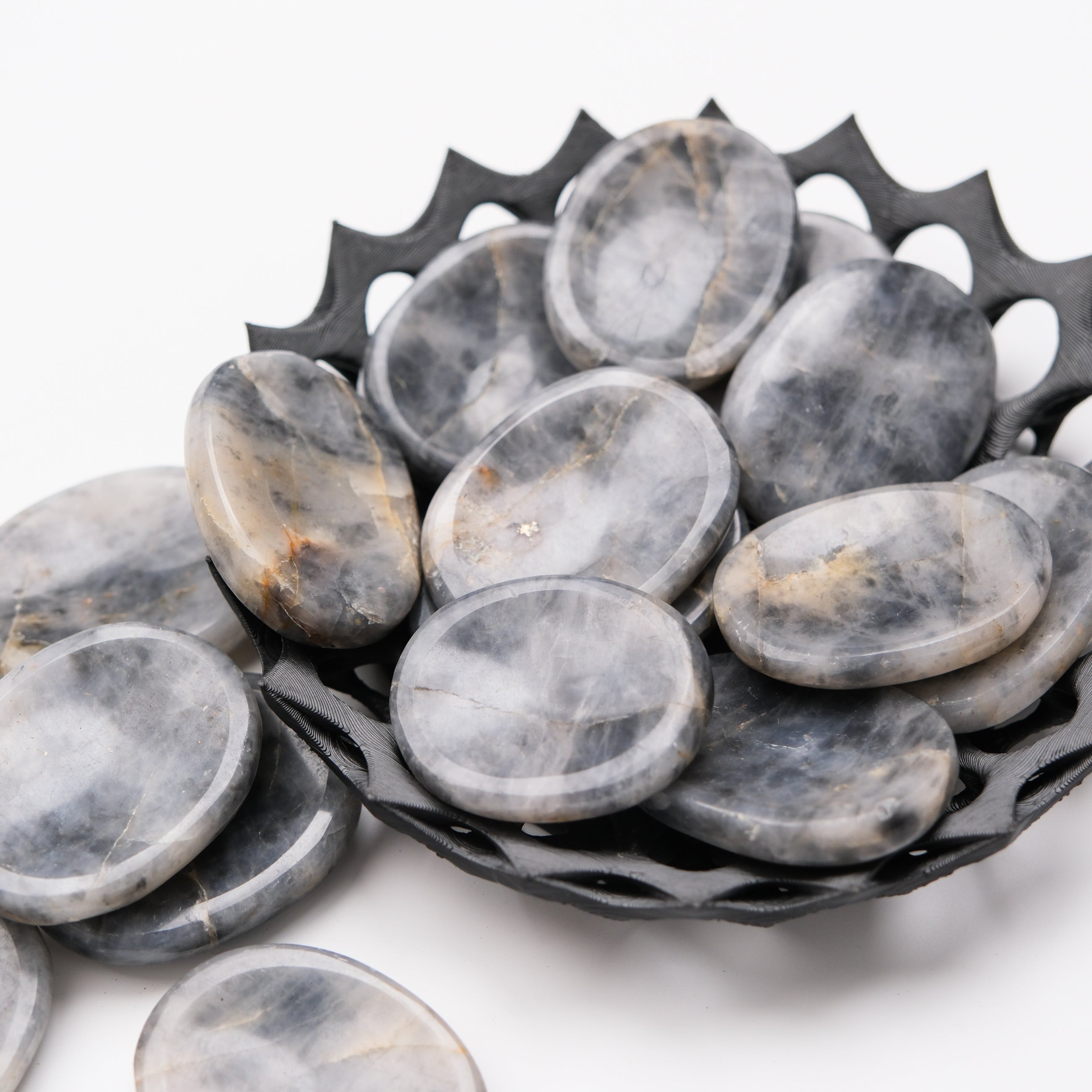 Iolite worry stone from Noctis Studio, smooth polished gemstone for stress relief and meditation.