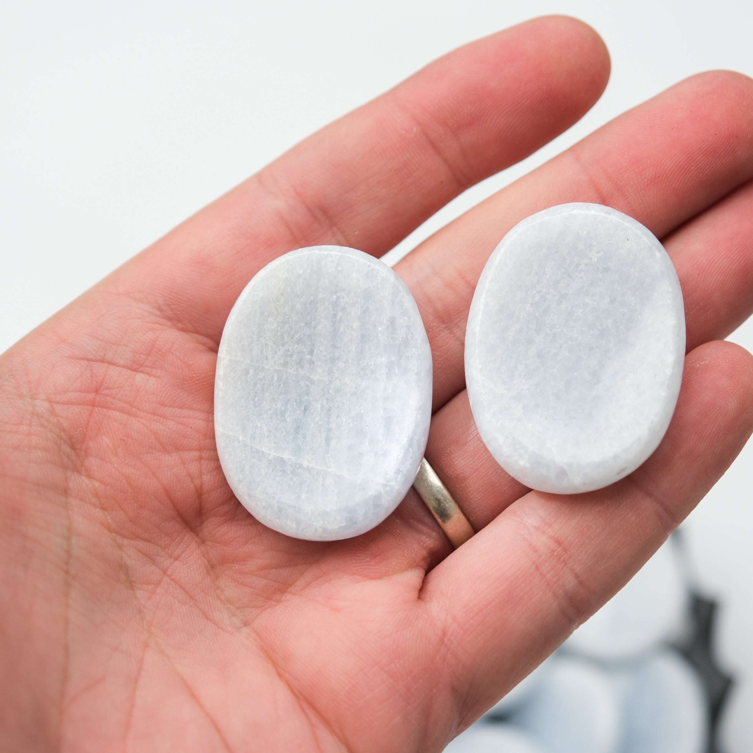 Blue calcite worry stone from Noctis Studio, smooth polished gemstone for stress relief and calming tactile experience.