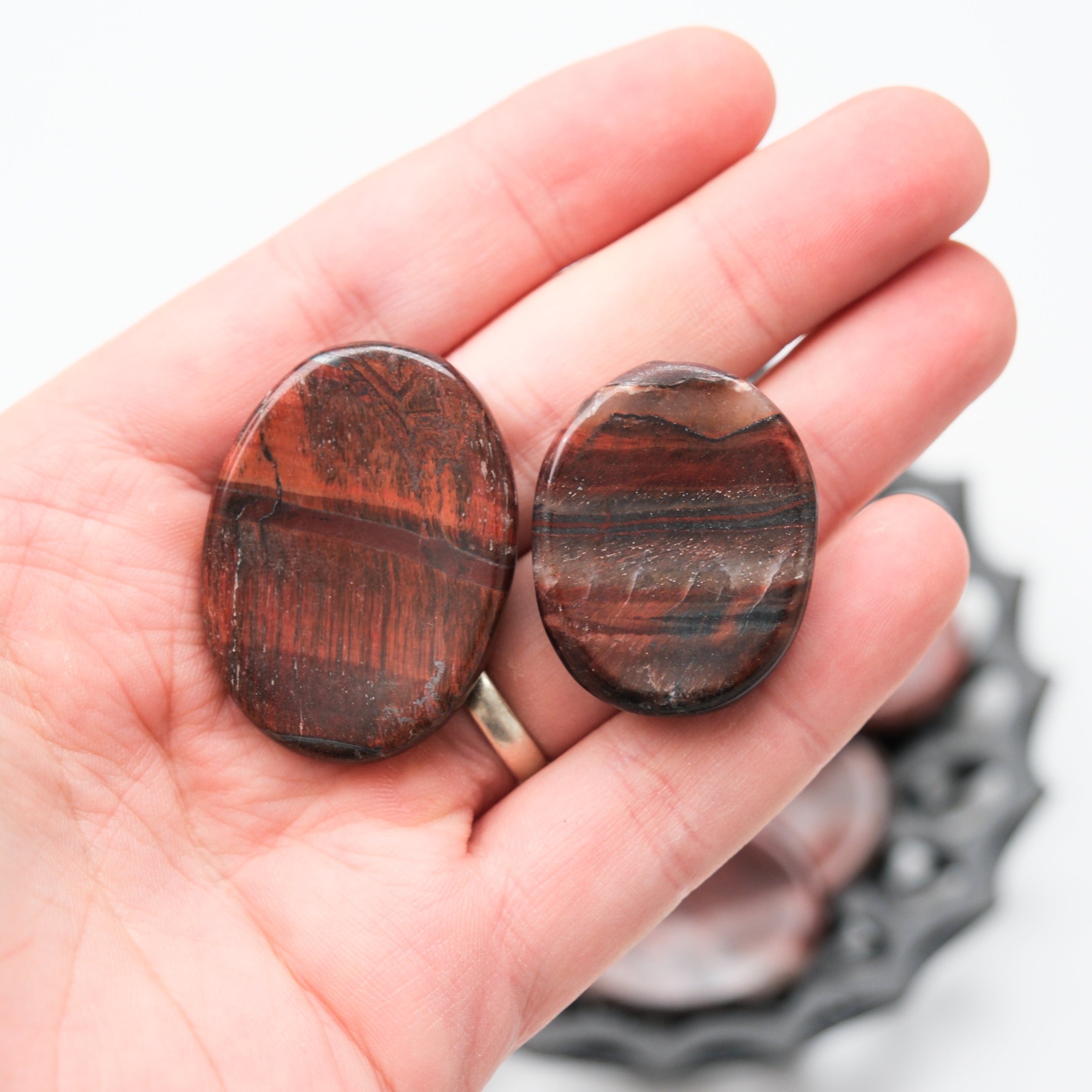 Red Tigers Eye worry stone with smooth polished surface and natural patterns, designed for calming stress relief.