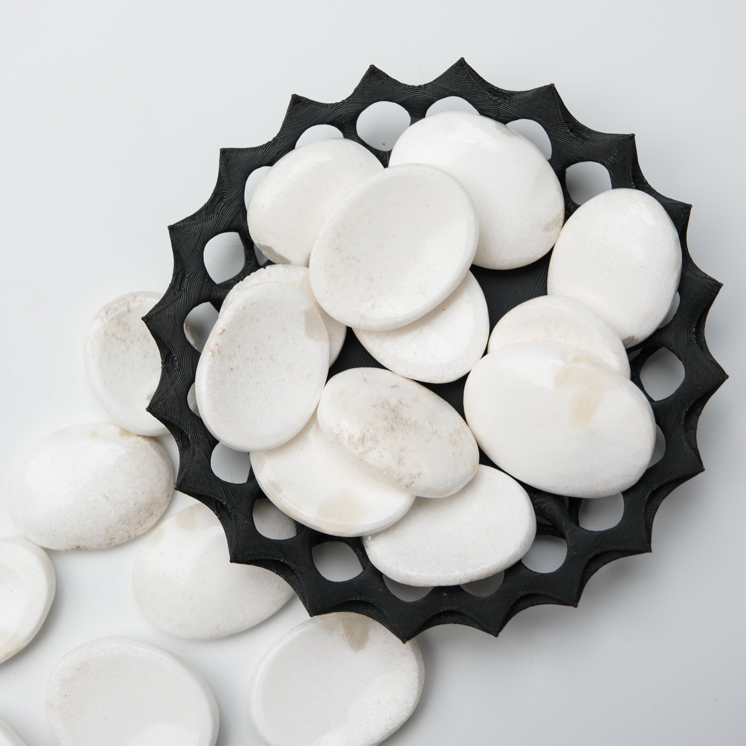 Scolecite worry stone from Noctis Studio featuring smooth, polished stone with natural white and translucent patterns for calming use.