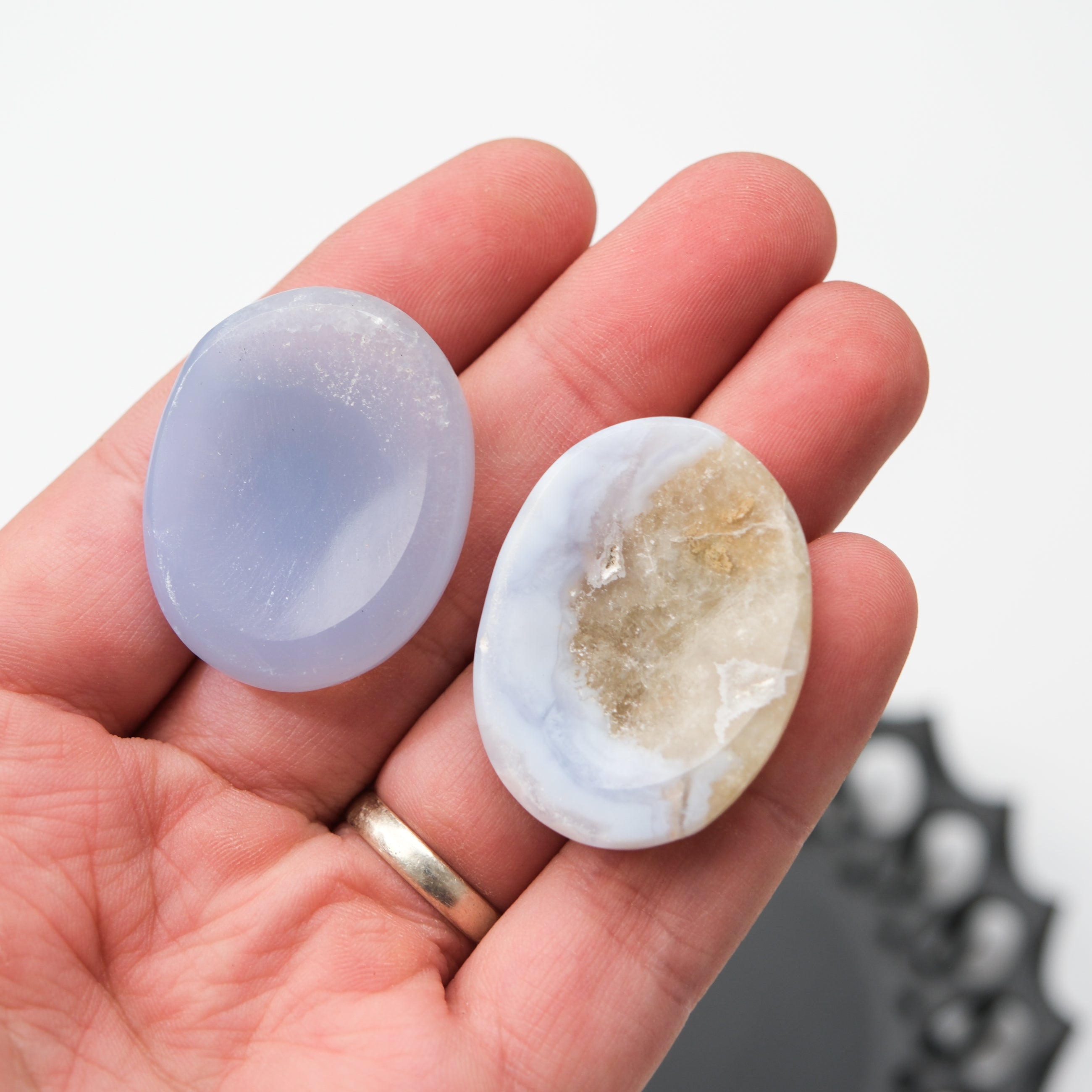 Blue Lace Agate worry stone from Noctis Studio, smooth polished gemstone with intricate blue and white lace-like patterns.