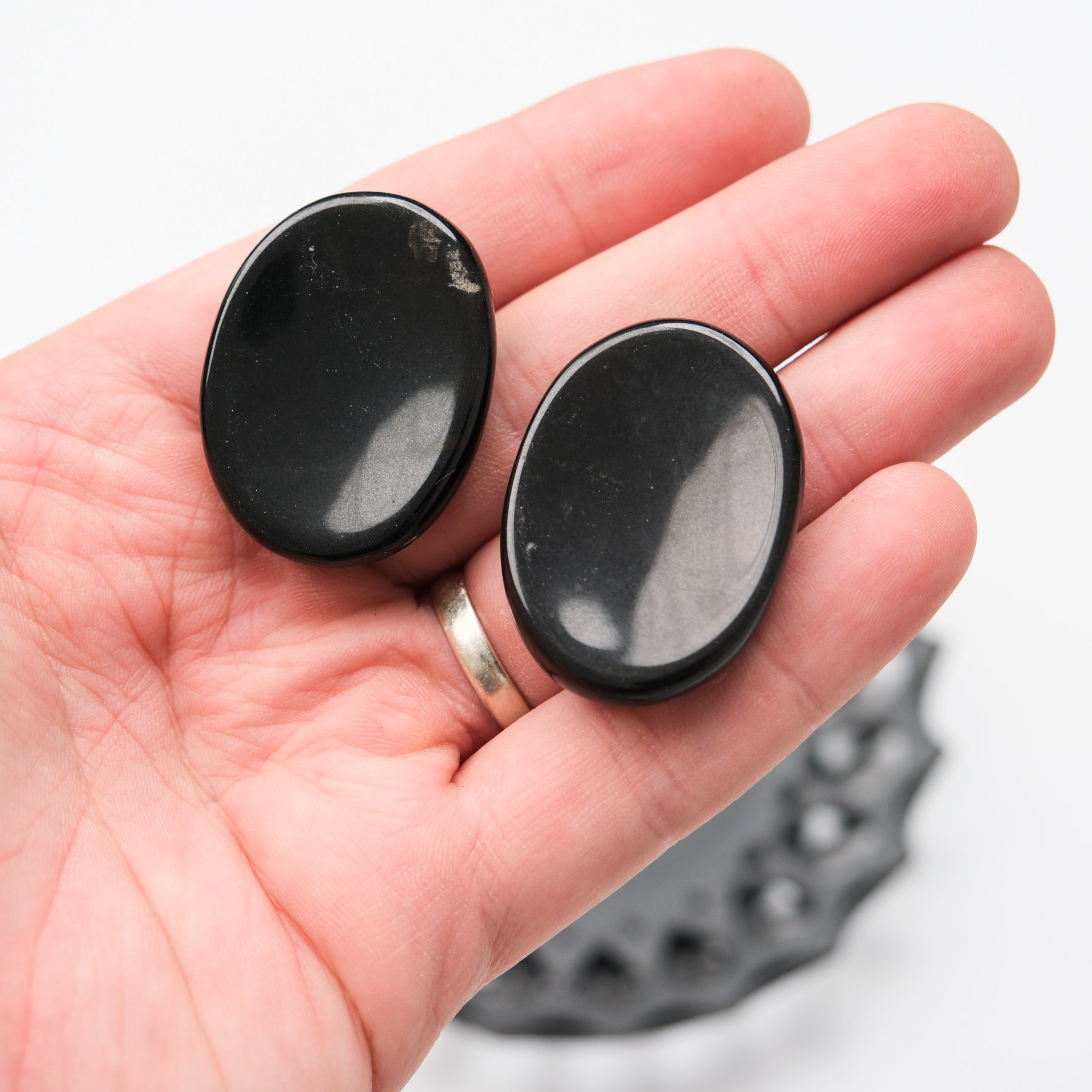 Black Jasper worry stone from Noctis Studio, smooth polished gemstone used for stress relief and meditation.