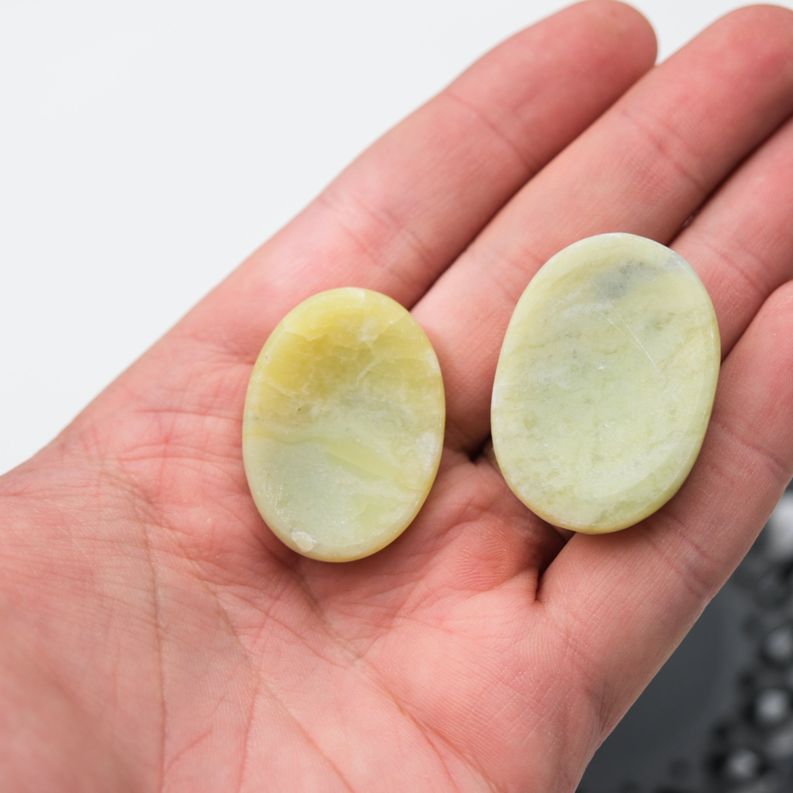 Serpentine worry stone from Noctis Studio, smooth polished gemstone for stress relief and tactile comfort.