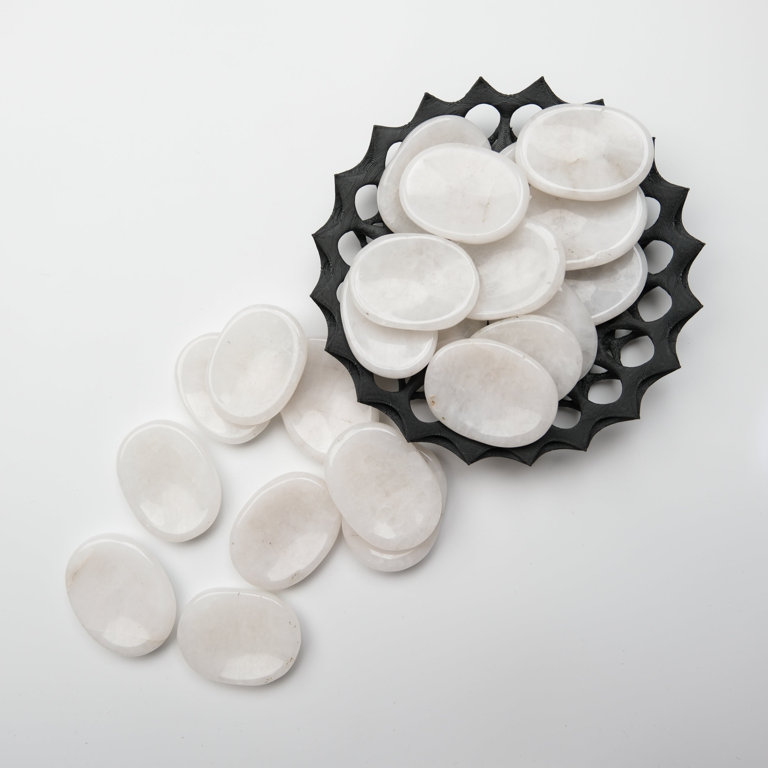 Smooth snow quartz worry stone from Noctis Studio, polished pebble with a calming, natural appearance for stress relief.