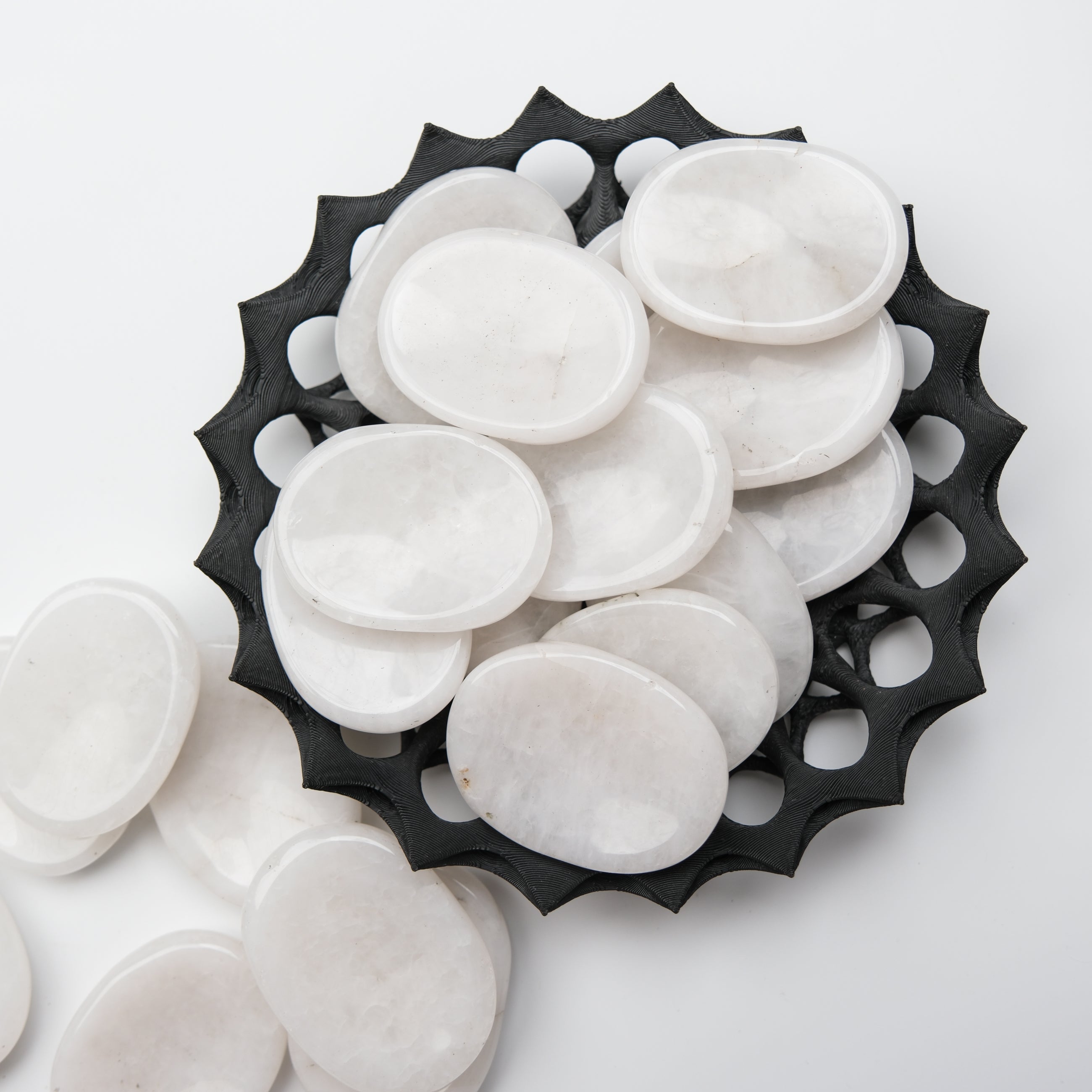Snow Quartz worry stone from Noctis Studio featuring smooth, polished white quartz with natural veining and rounded edges.