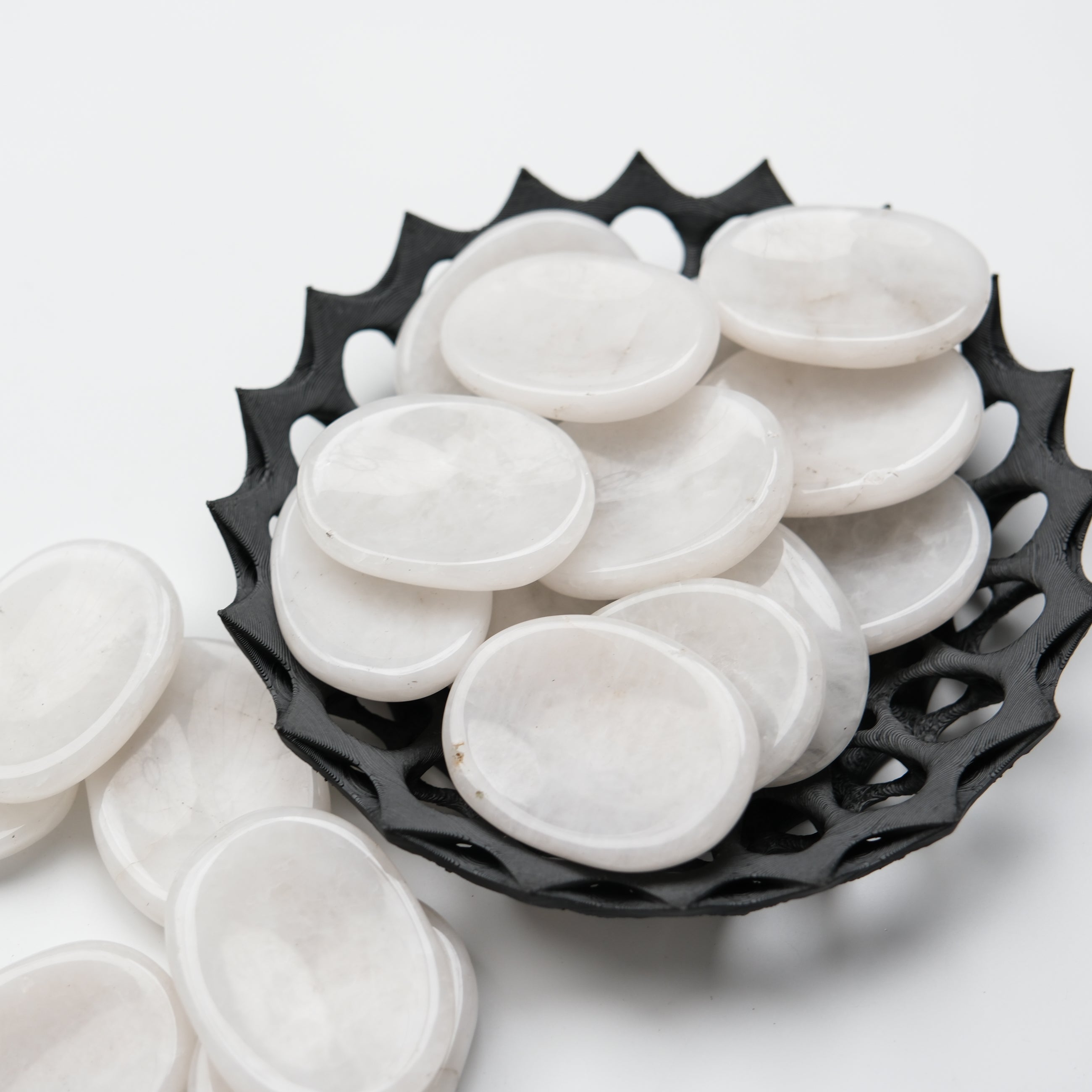 Snow Quartz worry stone from Noctis Studio showing smooth, polished surface and natural white, translucent crystal appearance.