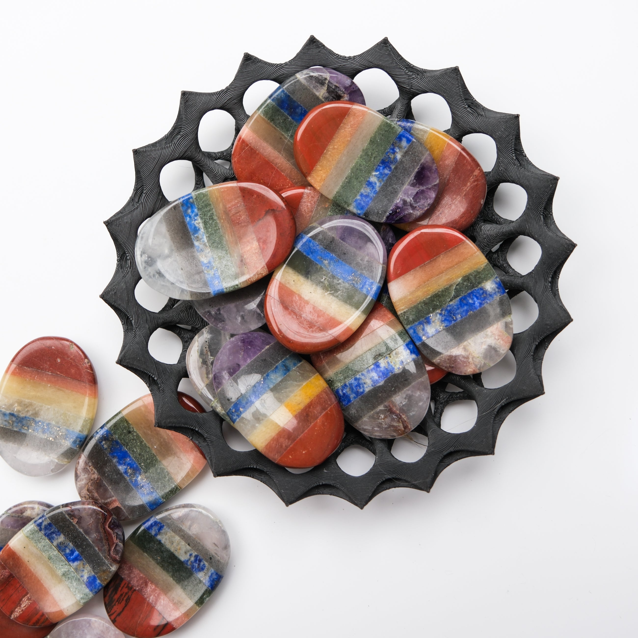 Noctis Studio Chakra worry stone with smooth, polished surface and engraved chakra symbols, used for stress relief and meditation.