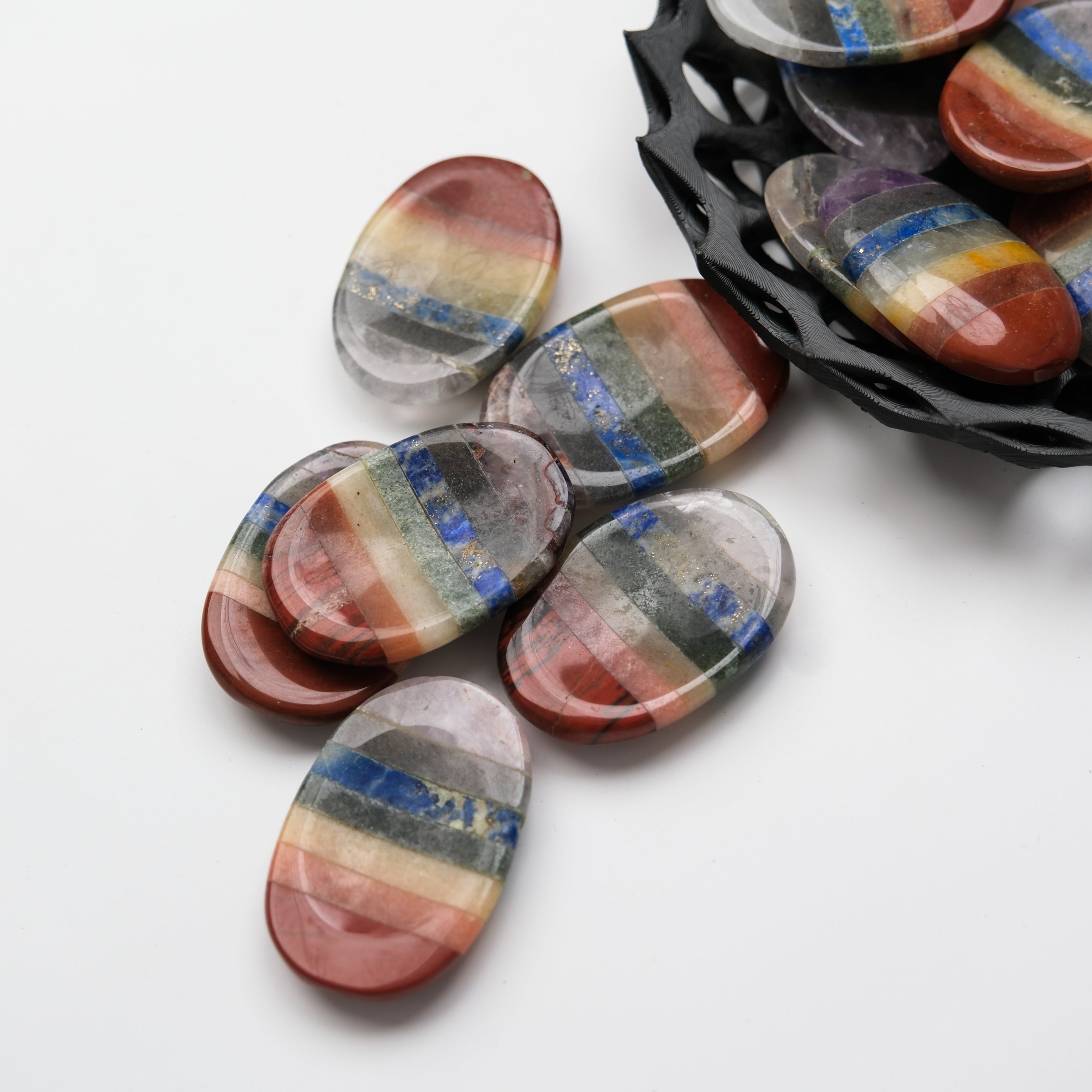 Noctis Studio Chakra worry stone, smooth polished gemstone for meditation and stress relief, shown in the image.