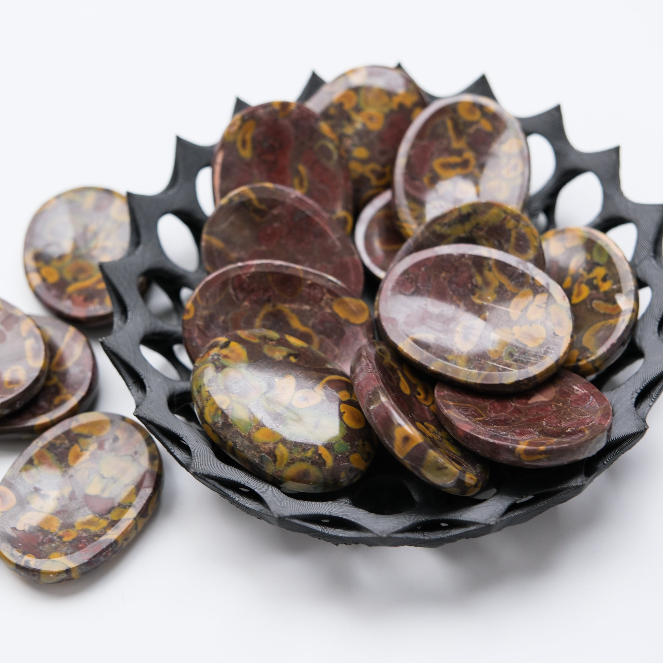 Smooth Fruit Jasper worry stone from Noctis Studio, showcasing polished, colorful gemstone with rounded, pocket-sized design.