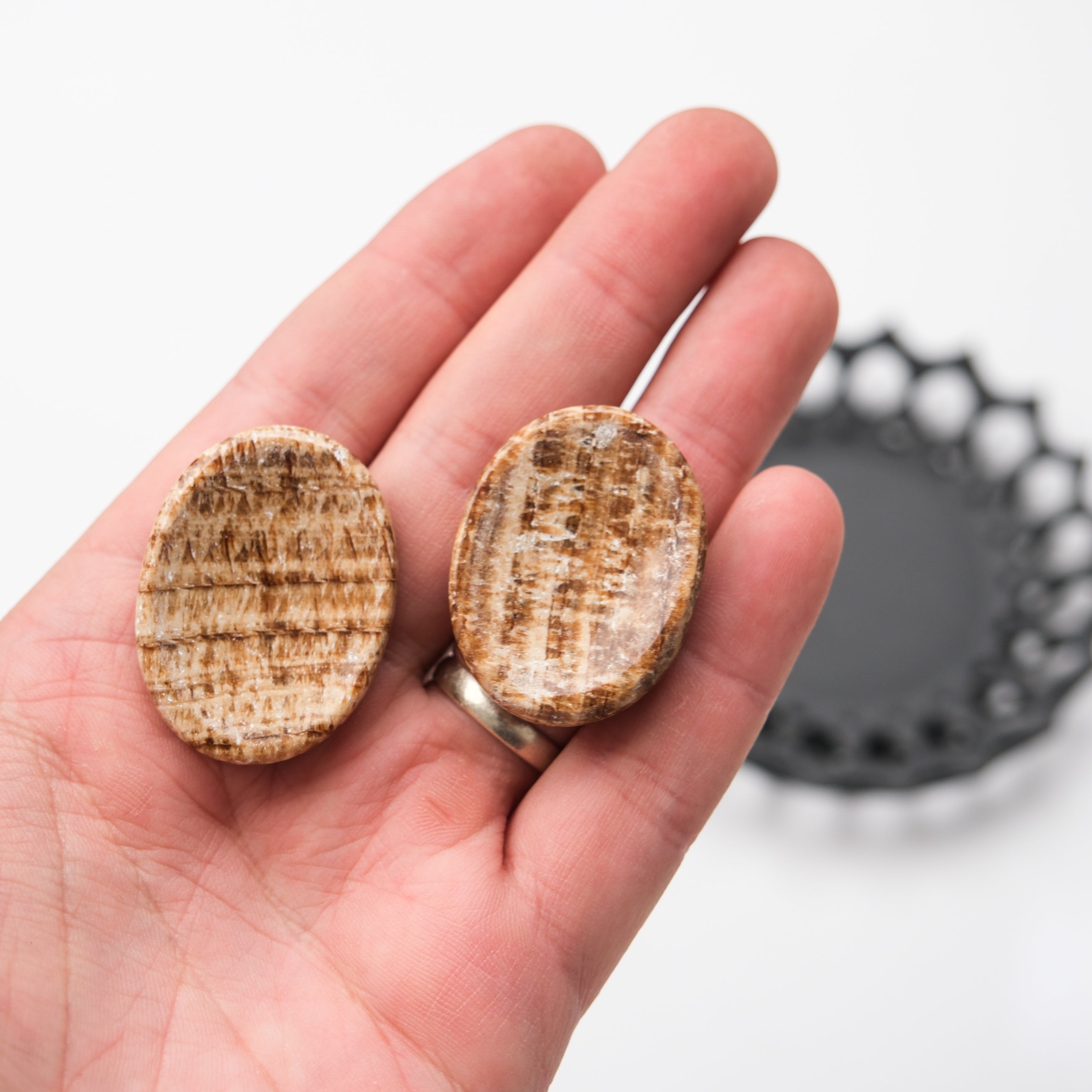 Noctis Studio Aragonite worry stone with smooth, polished surface, perfect for stress relief and calming hand-held meditation.