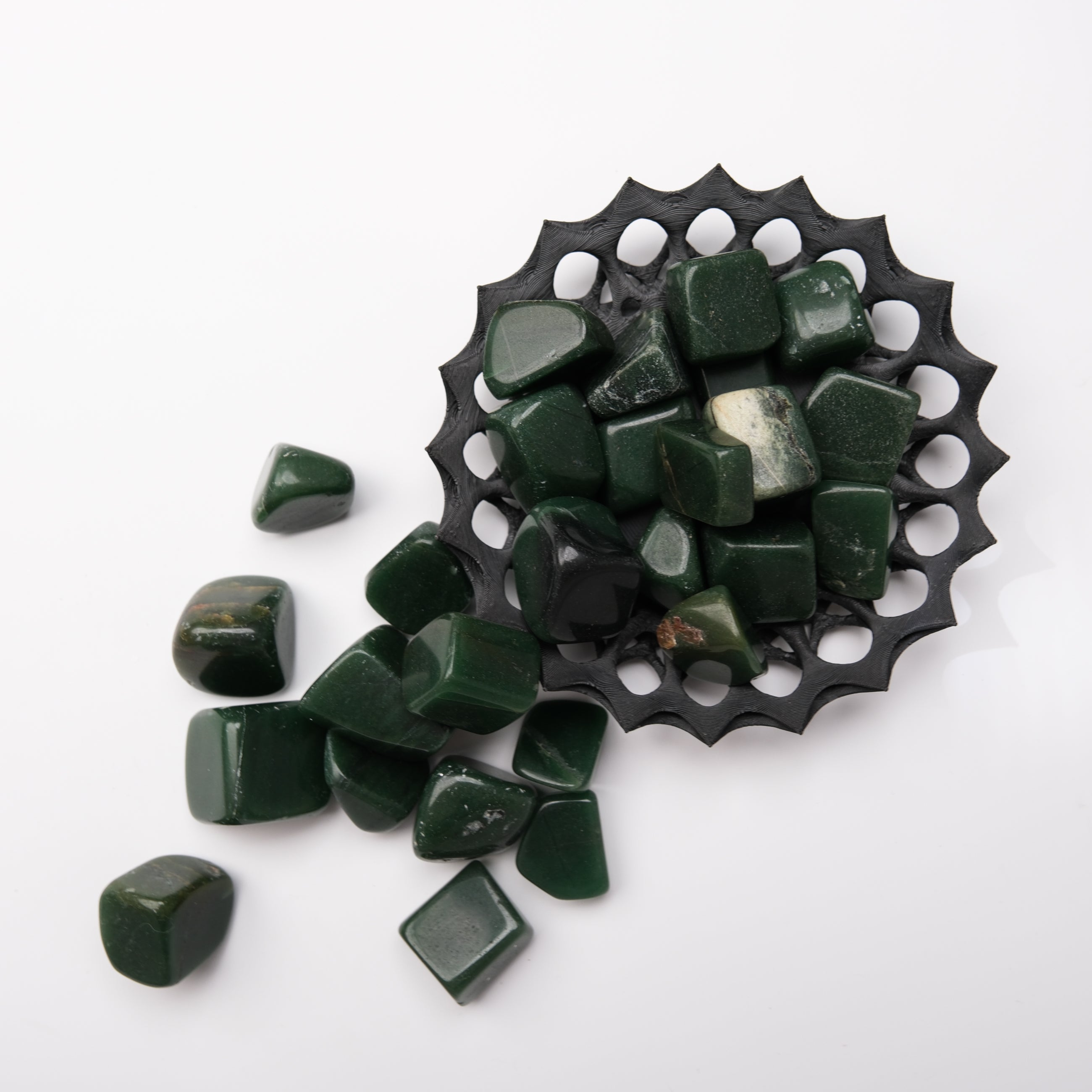 Dark green aventurine tumble stone from Noctis Studio, smooth polished gemstone with natural green coloration and subtle patterns.