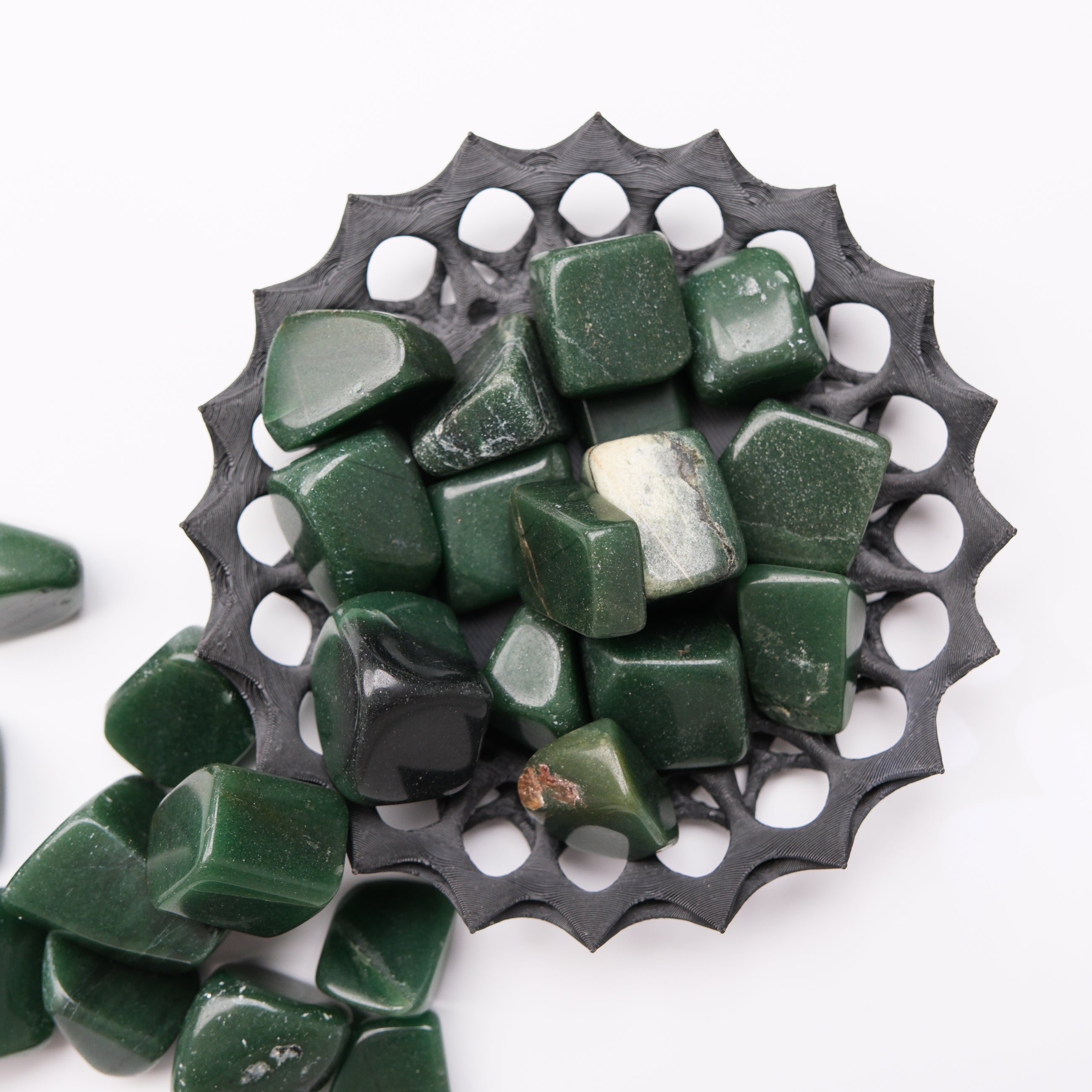Dark green aventurine tumble stone from Noctis Studio, showing smooth, polished mineral with natural green coloration.