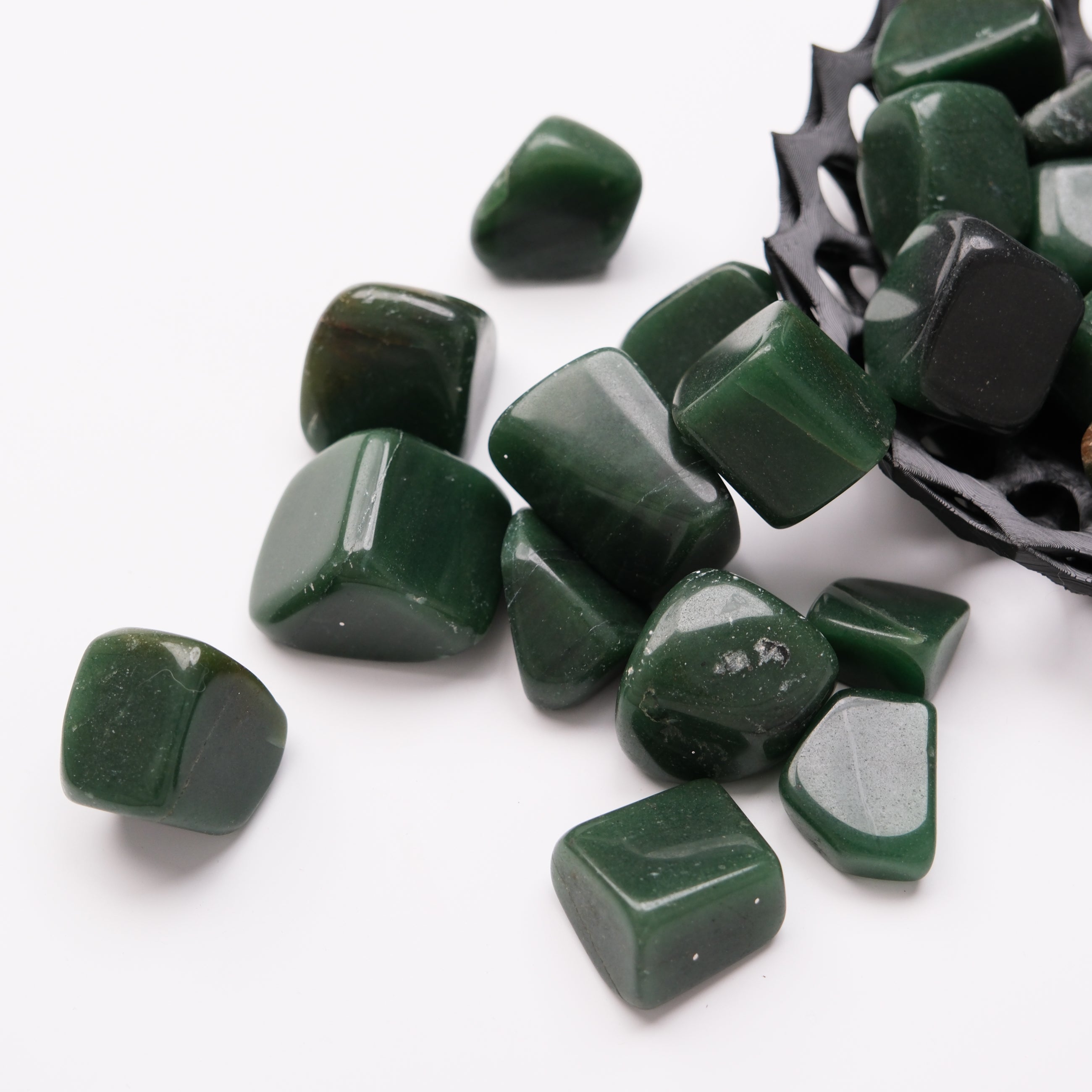 Dark green aventurine tumble stone from Noctis Studio, smooth polished gemstone with natural patterns and vibrant green color.