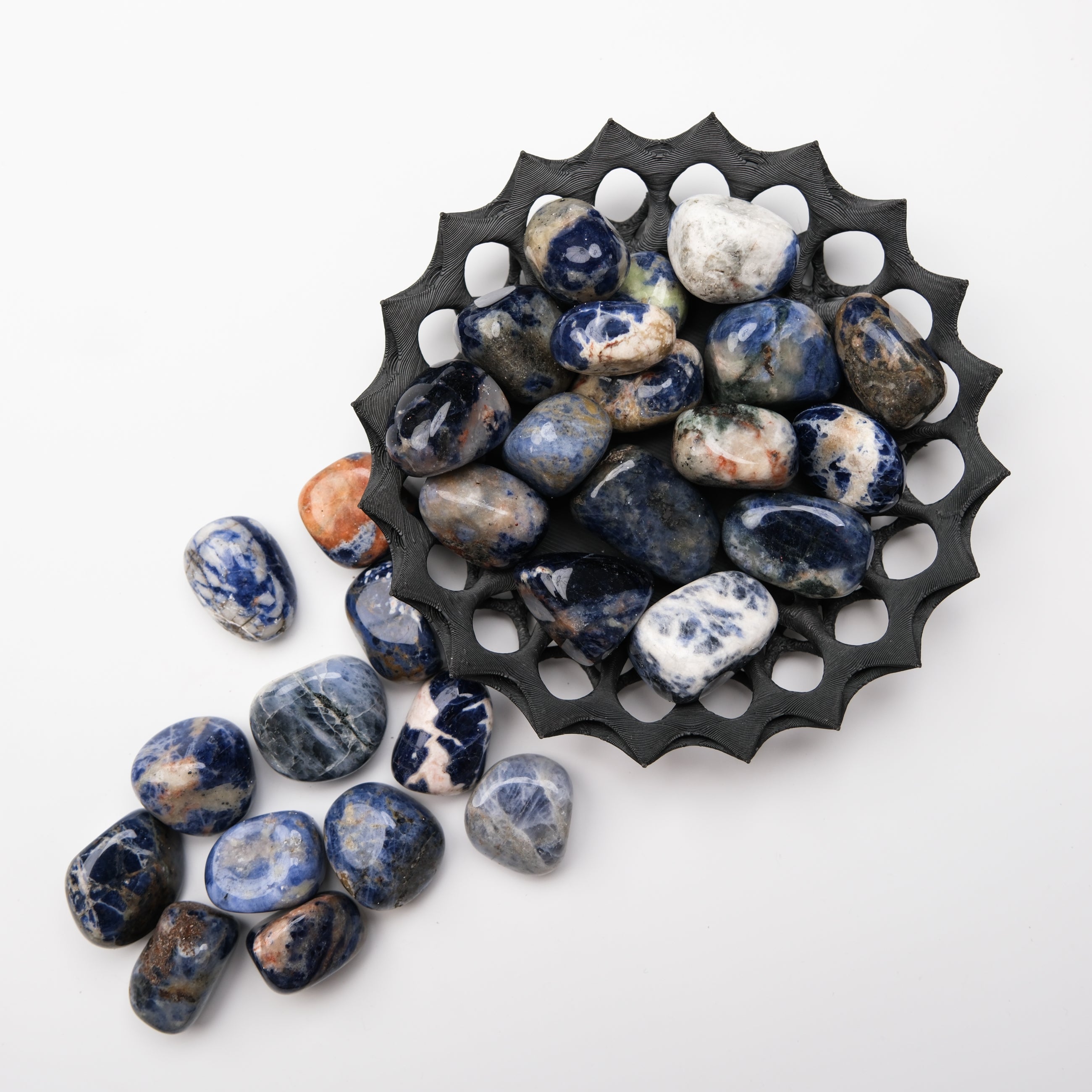 Blue Sodalite tumble stone from Noctis Studio, polished mineral with deep blue and white veining, perfect for crystal healing.