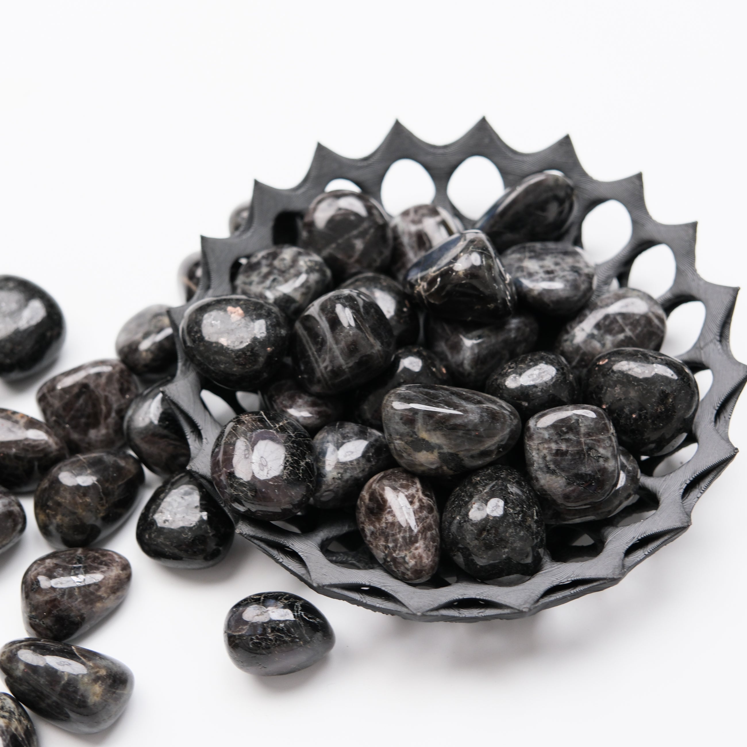 Noctis Studio Northsite Tumble Stone showing a polished, smooth natural mineral with earthy green and brown tones.