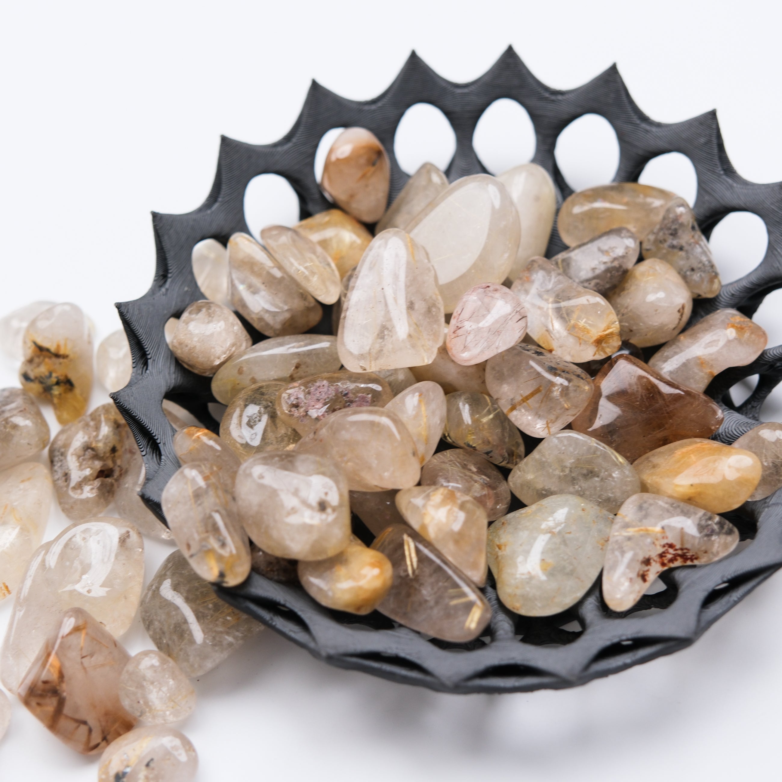 Golden Rutilated Quartz tumble stone from Noctis Studio showing golden needle inclusions and smooth polished surface.