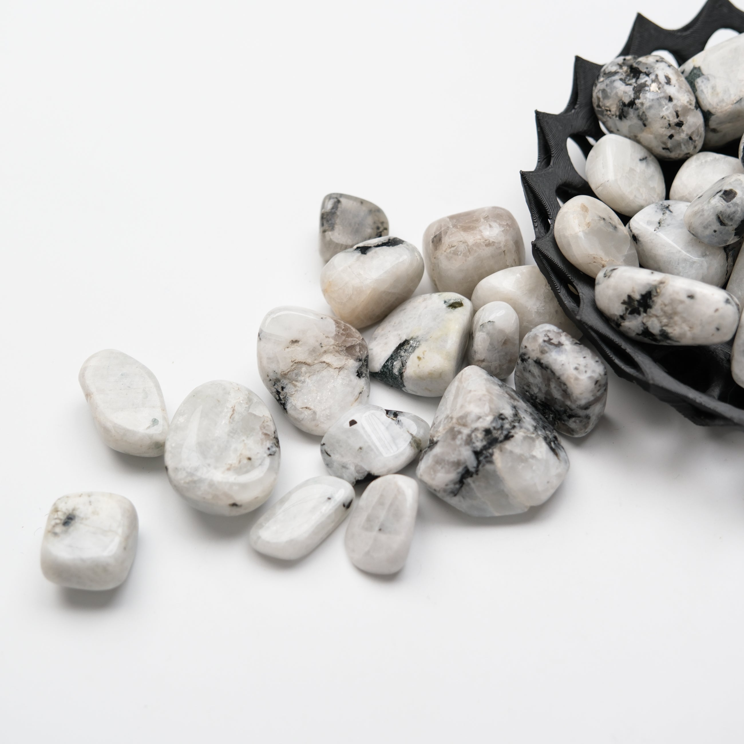Noctis Studio moonstone tumble stone with iridescent shimmer, smooth polished surface, and natural rounded shape.