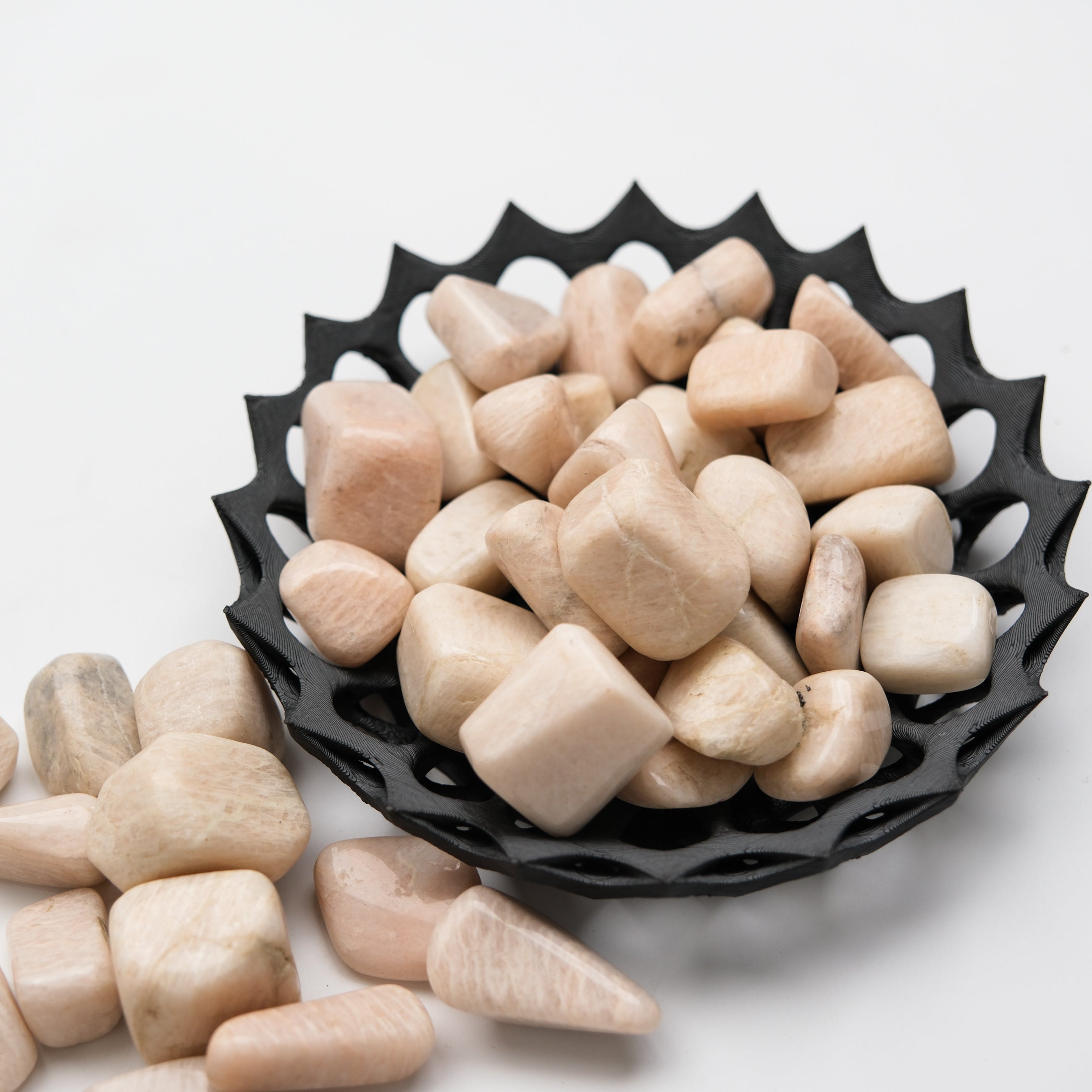 Cream moonstone tumble stone from Noctis Studio, smooth polished gemstone with soft cream and subtle shimmer.