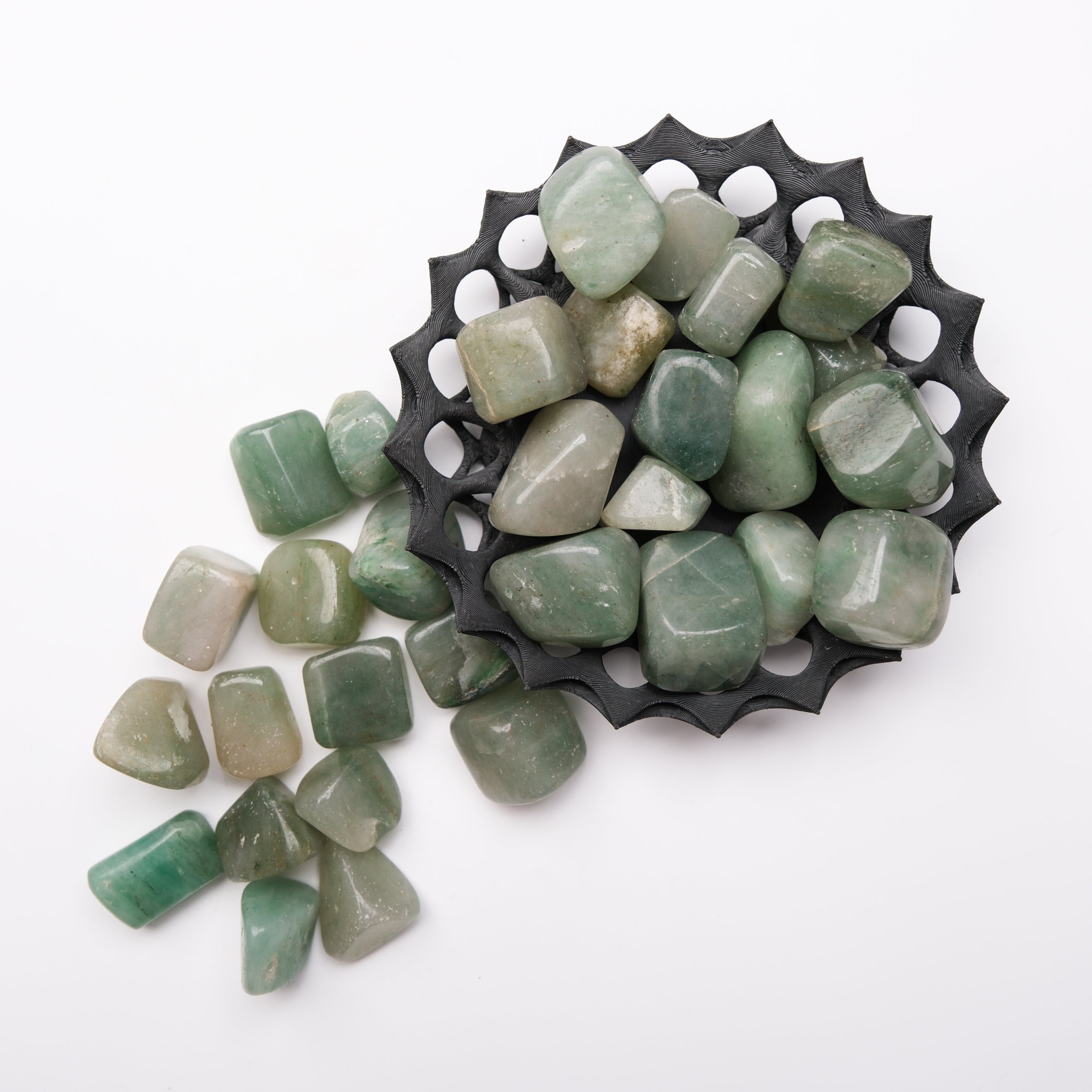 Green Aventurine tumble stone from Noctis Studio, polished green gemstone with natural stone texture and smooth surface.