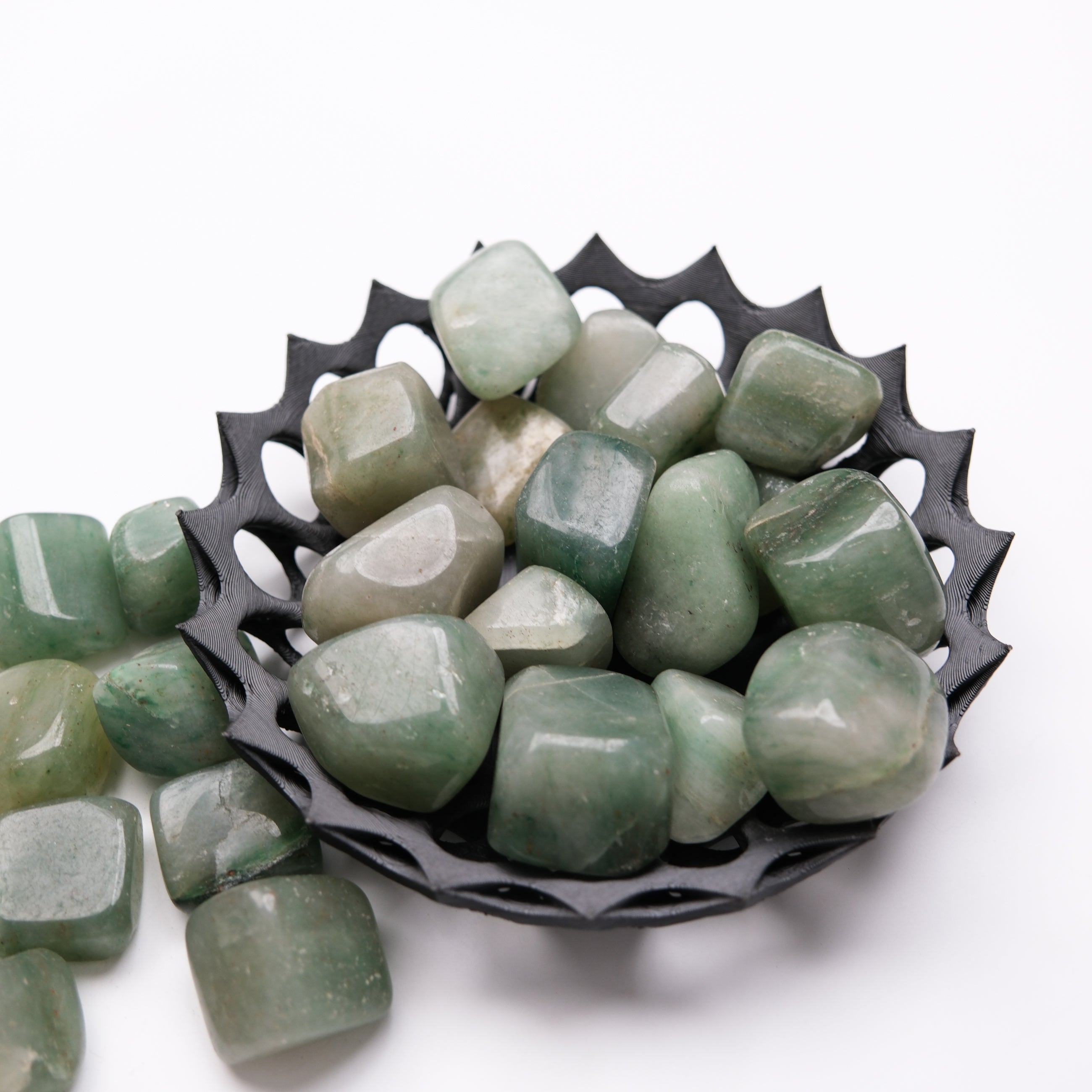 Green Aventurine tumble stone from Noctis Studio, smooth polished gemstone showing vibrant green color and natural stone texture.