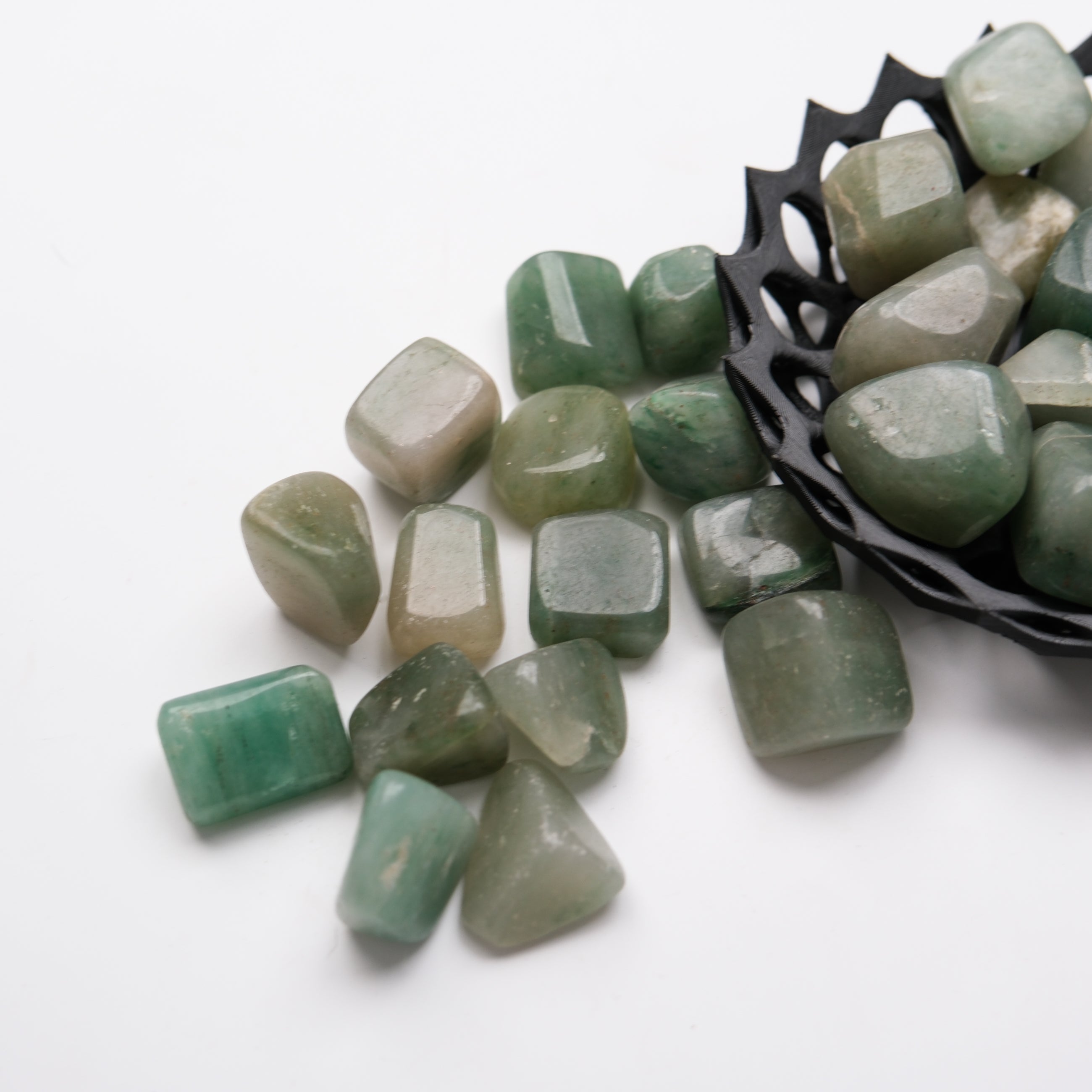 Green Aventurine tumble stone from Noctis Studio, showing a polished green gemstone with natural variations and smooth surface.