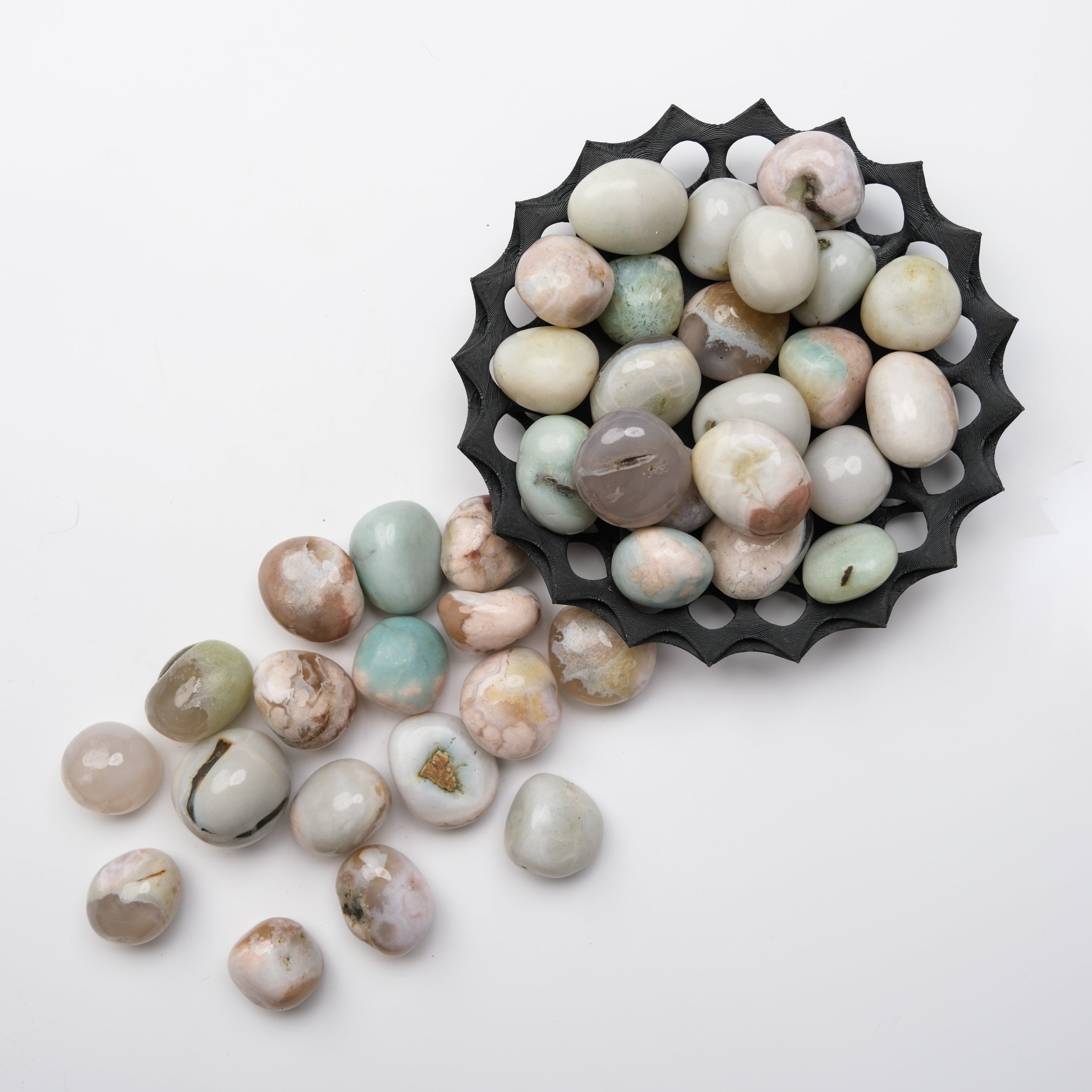 Green Flower Agate tumble stone from Noctis Studio, smooth polished gemstone with vibrant green floral patterns.