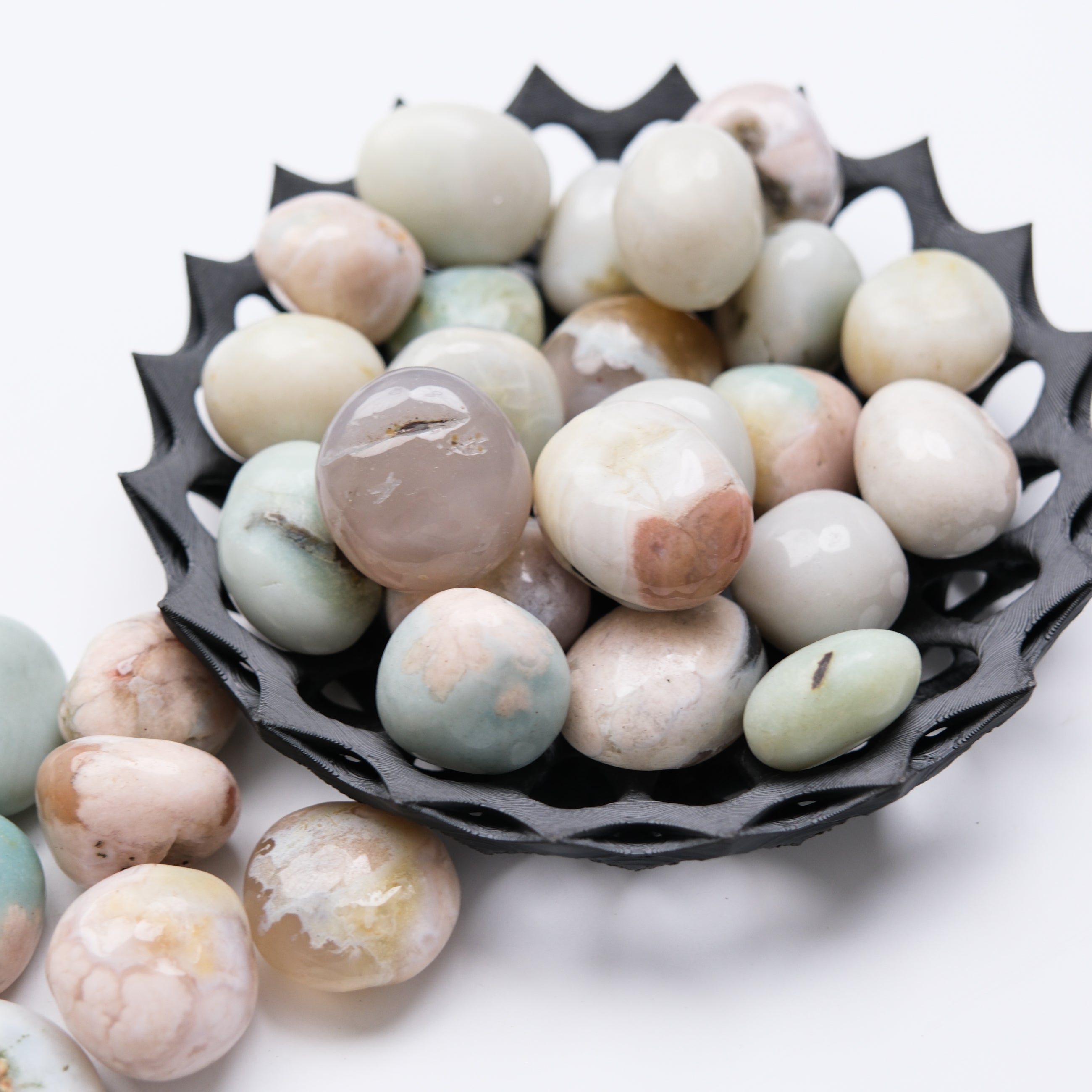Green Flower Agate tumble stone from Noctis Studio, smooth polished mineral with vibrant green and floral patterns.