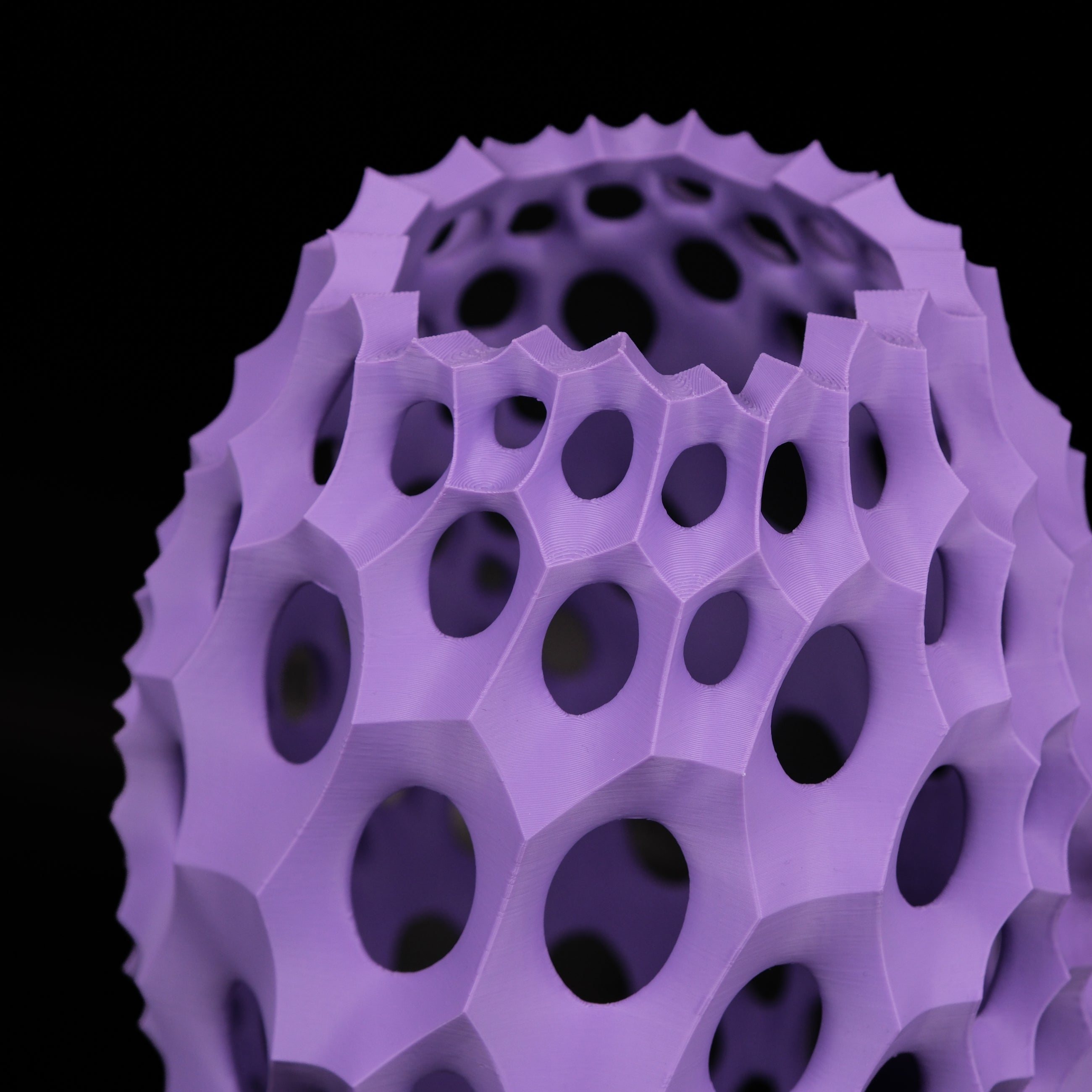 Modern Machine lattice vase with intricate geometric pattern and sleek ceramic finish on a neutral background.