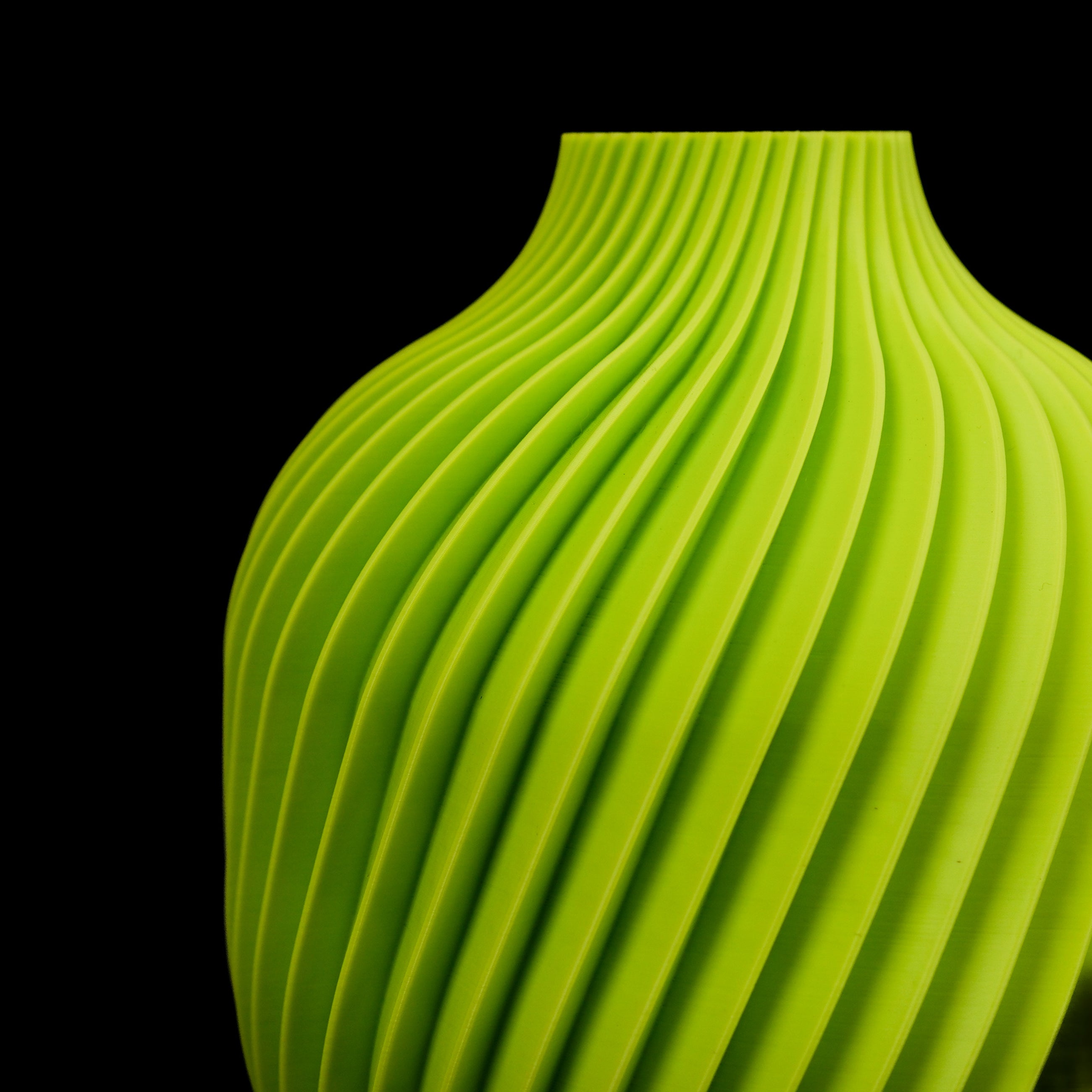 Modern Machine Vortex Vase with swirling design, clear glass body, and sleek cylindrical shape, perfect for decorative floral arrangements.