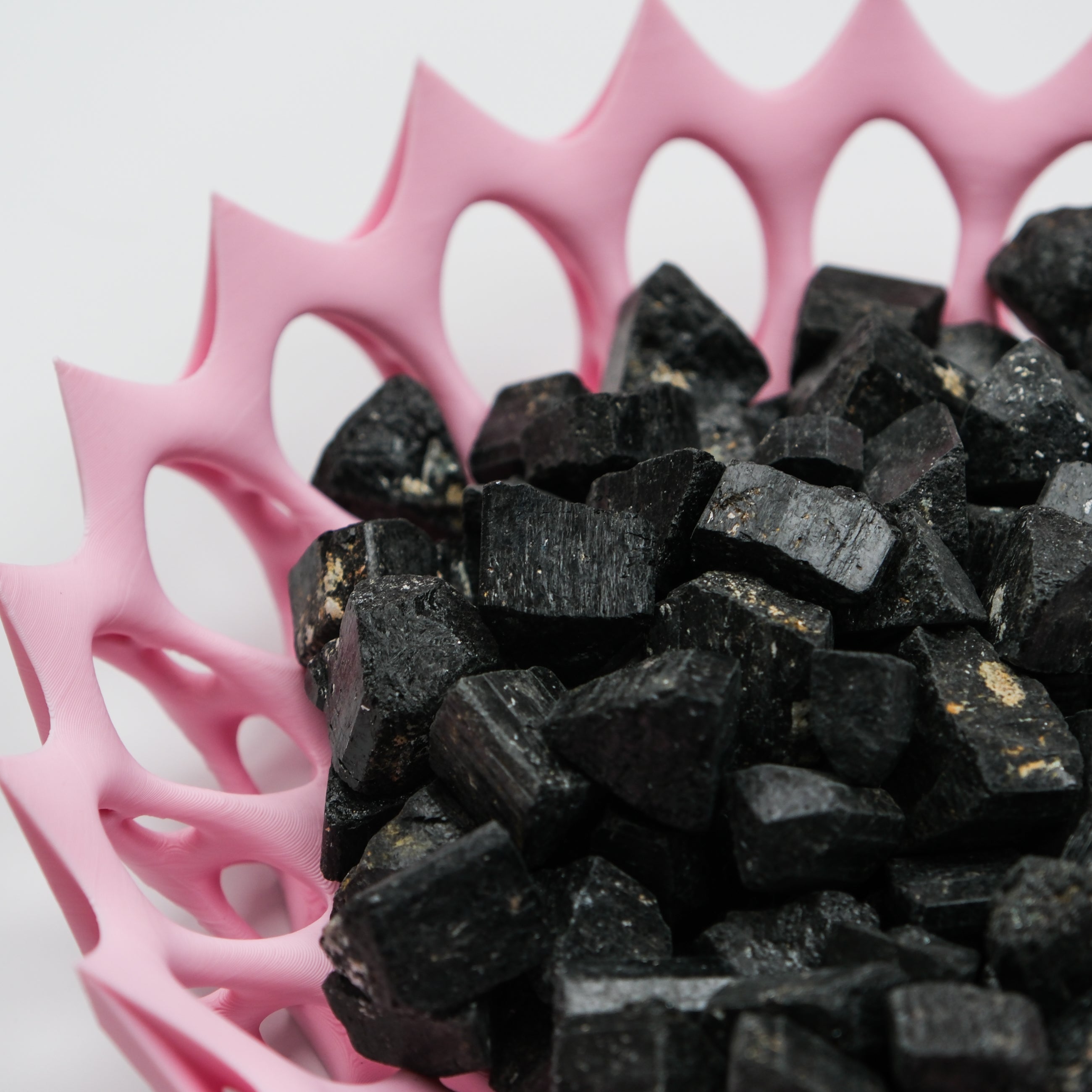 Rough black tourmaline mineral specimen with natural, textured black surface, from Noctis Studio.