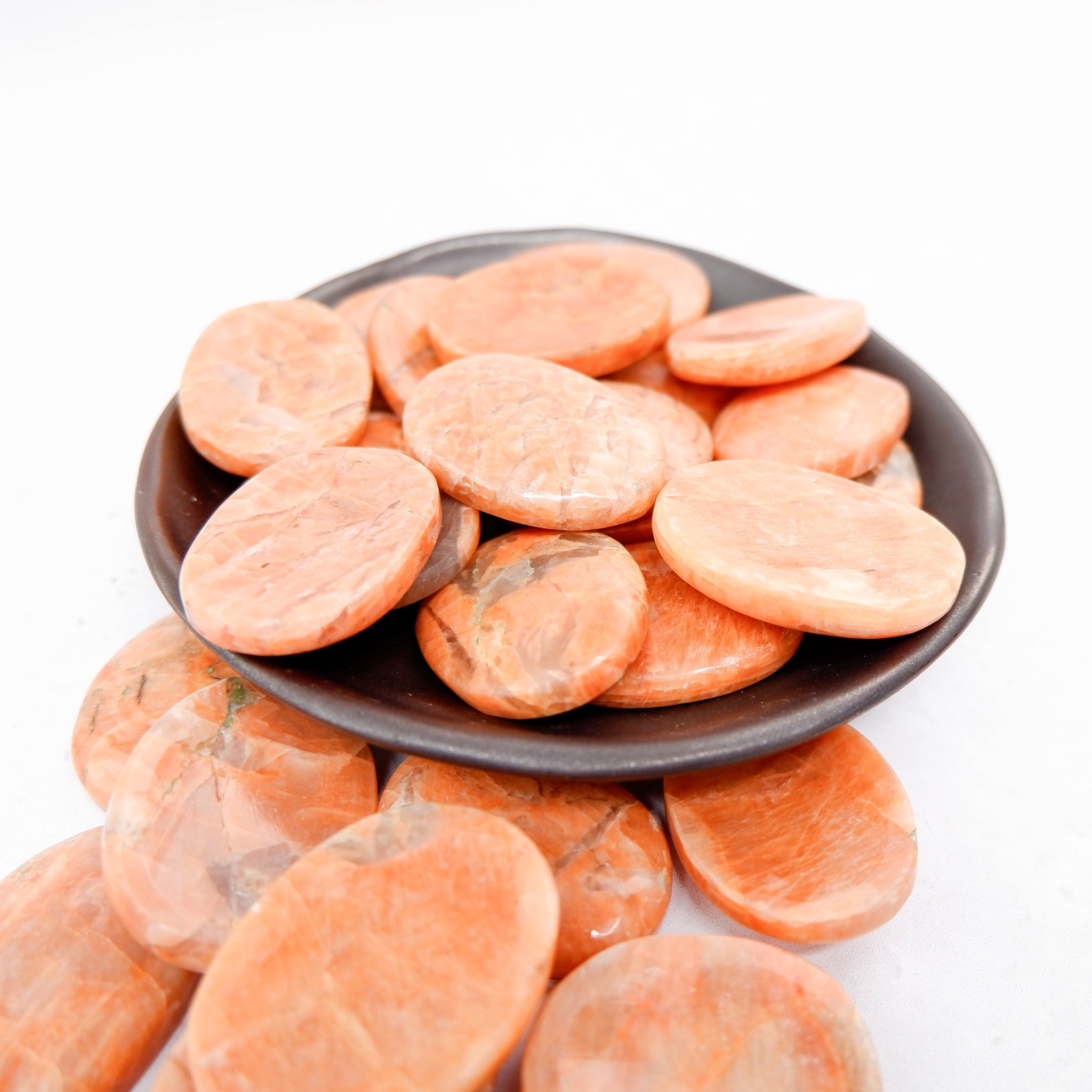 Orange Moonstone worry stone from Noctis Studio, smooth polished gemstone for calming and stress relief.