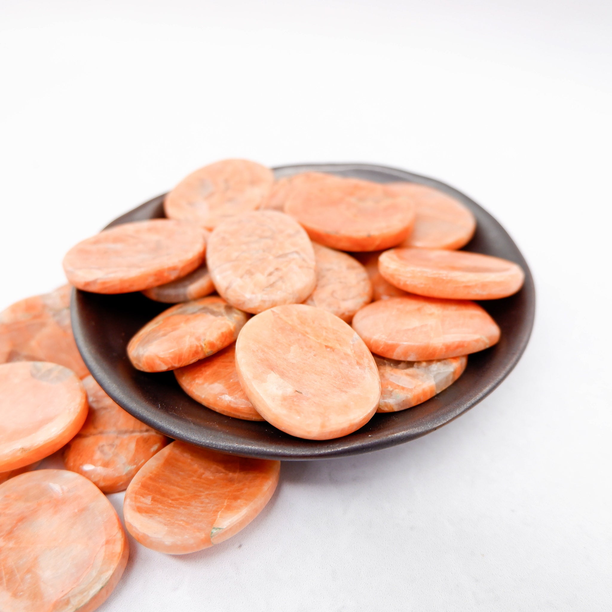 Orange Moonstone worry stone from Noctis Studio, smooth polished gemstone for calming and stress relief.
