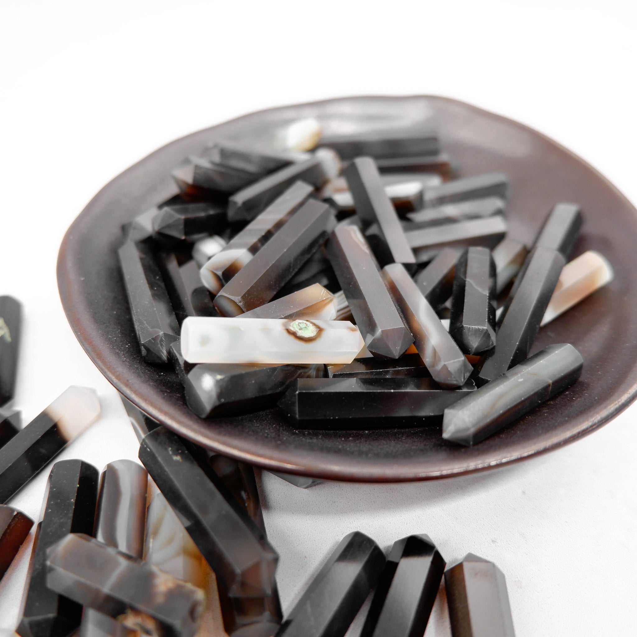 Black Sulemani Agate single gridding point by Noctis Studio, showcasing a polished black agate stone with a pointed tip.
