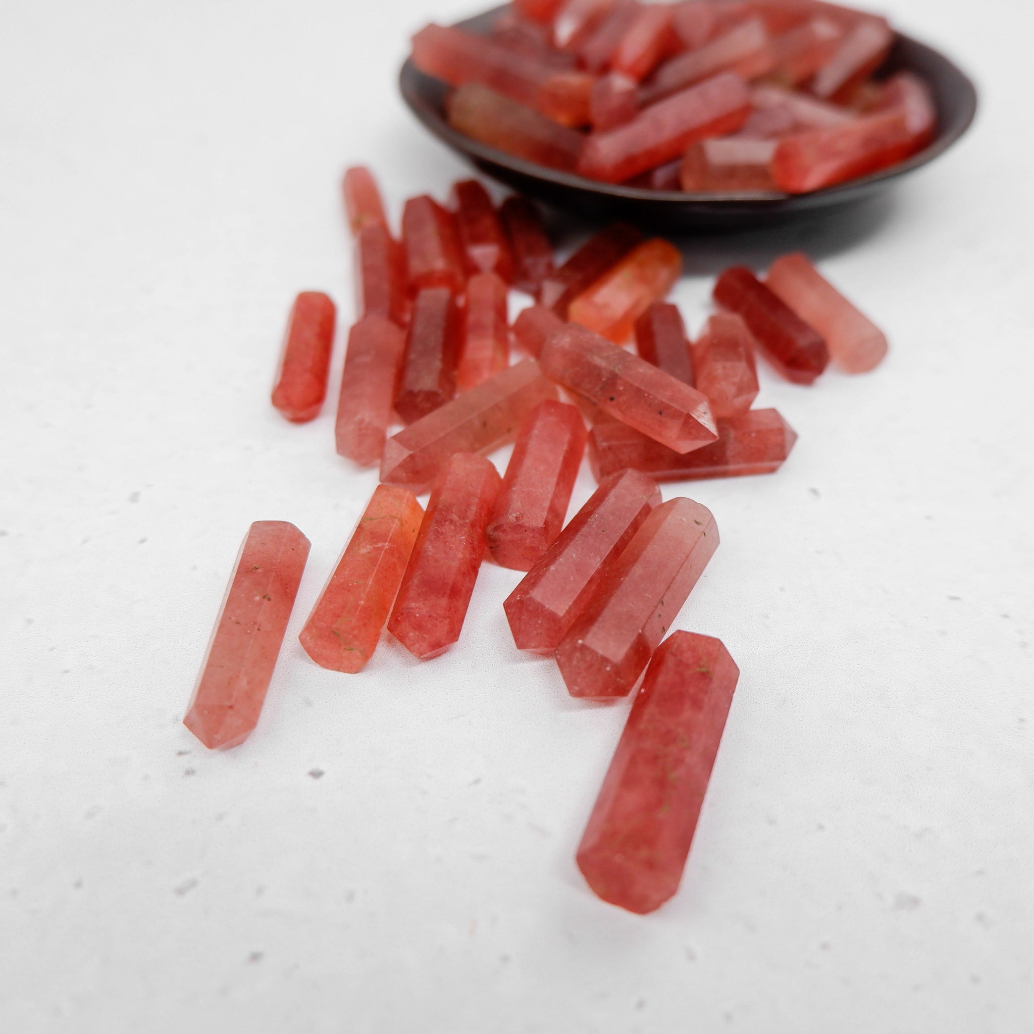 Strawberry Quartz single gridding point by Noctis Studio, showcasing a polished crystal with vibrant pink hues and pointed tip.