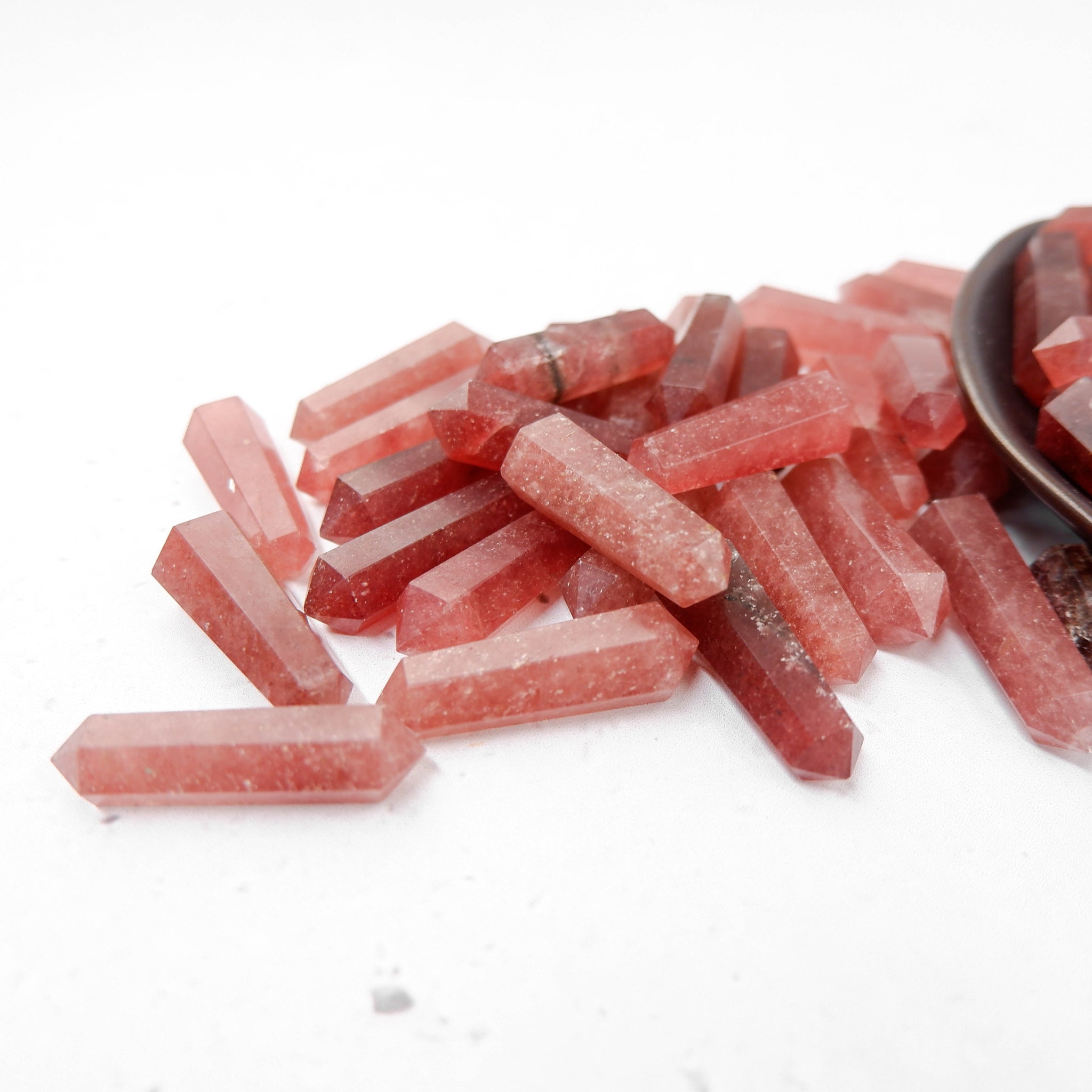 Strawberry Quartz Double Gridding Point by Noctis Studio, a clear quartz crystal with pink strawberry hue, ideal for crystal healing.