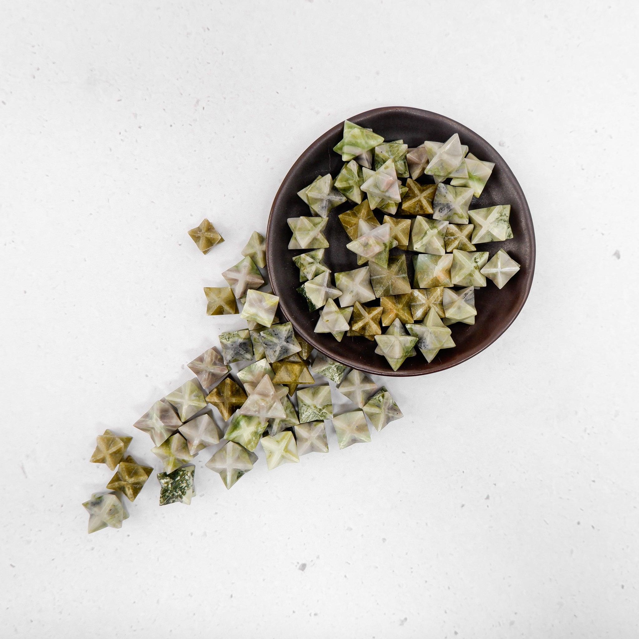Noctis Studio Serpentine Star decorative star sculpture with intricate serpentine metal design, displayed on a neutral background.