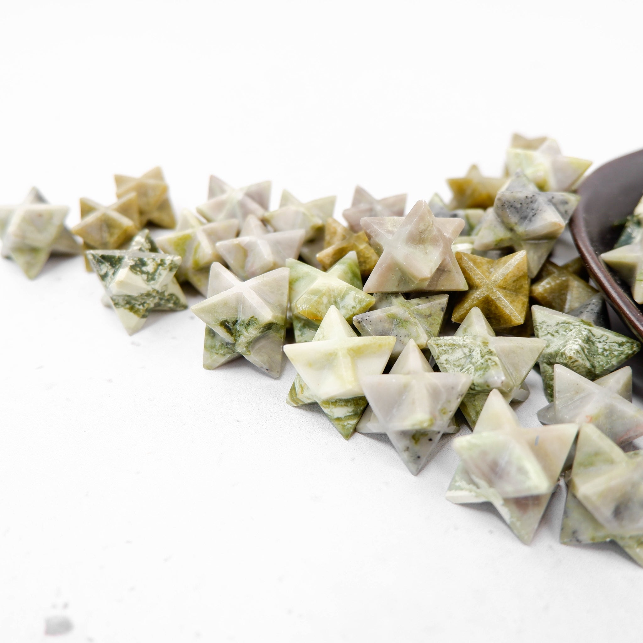 Serpentine star sculpture by Noctis Studio, featuring a detailed celestial star design with a smooth, polished finish.