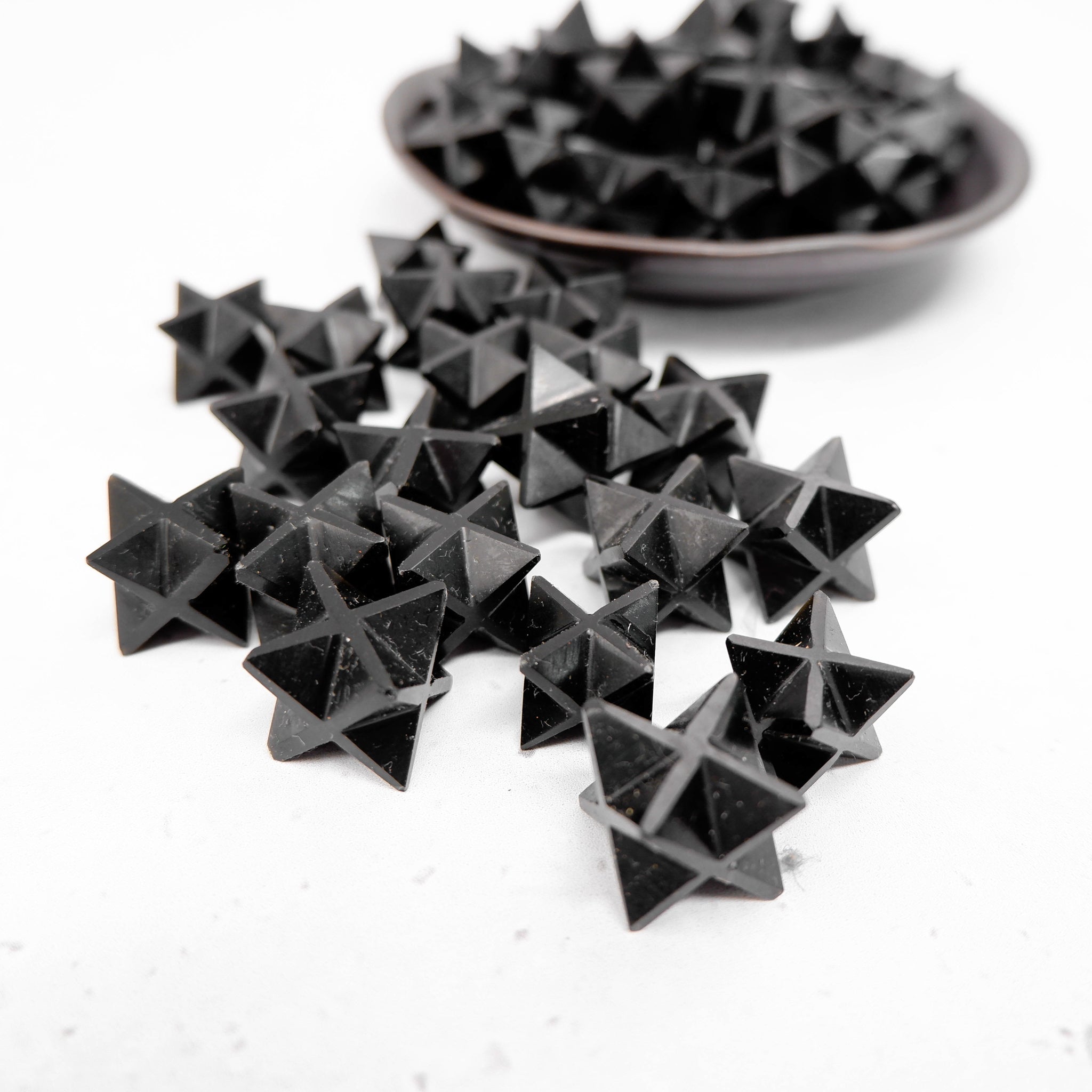 Black Jasper Star by Noctis Studio, a polished star-shaped gemstone with rich black tones and subtle natural patterns.