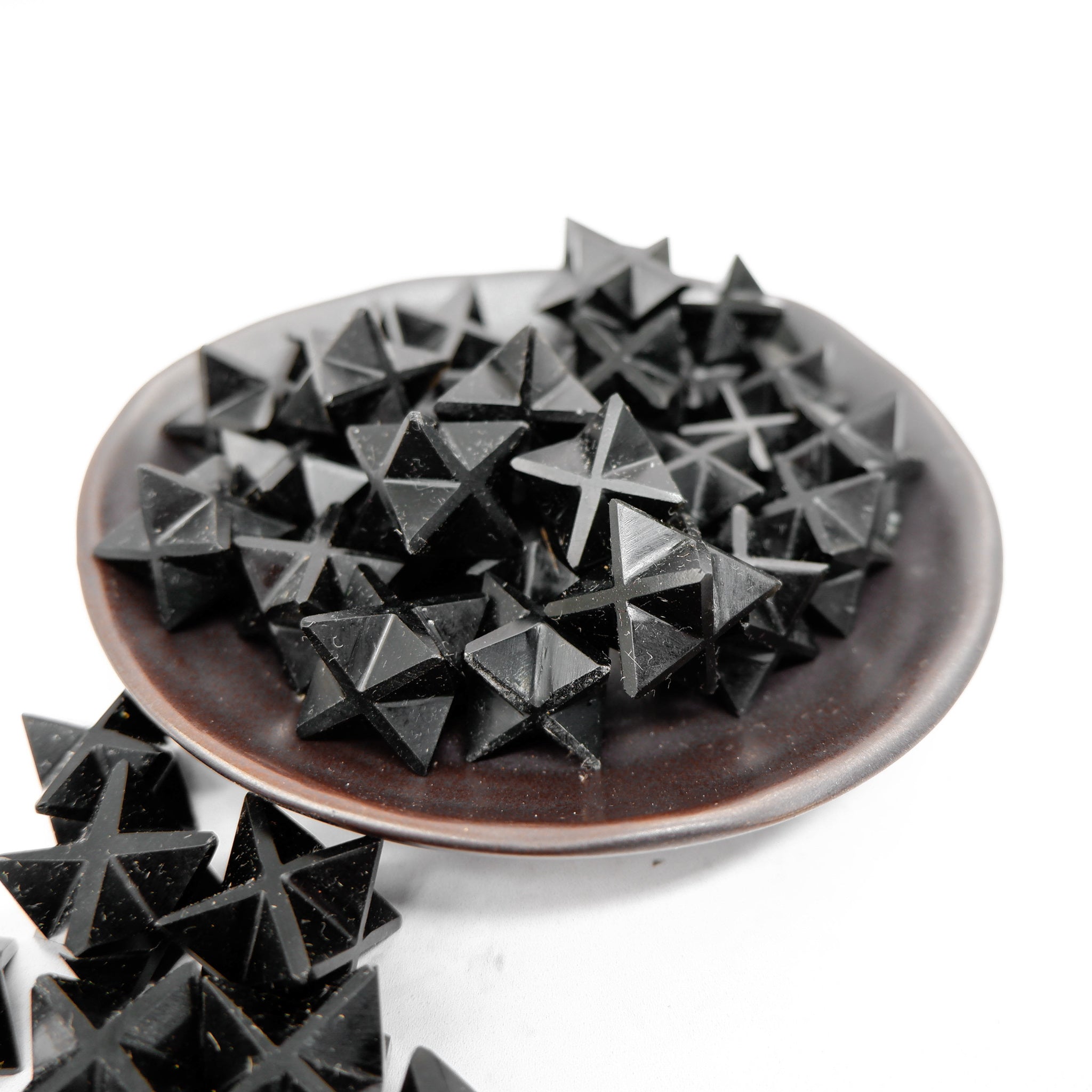 Black Jasper Star by Noctis Studio featuring a polished black jasper gemstone shaped like a star with smooth, glossy surface.
