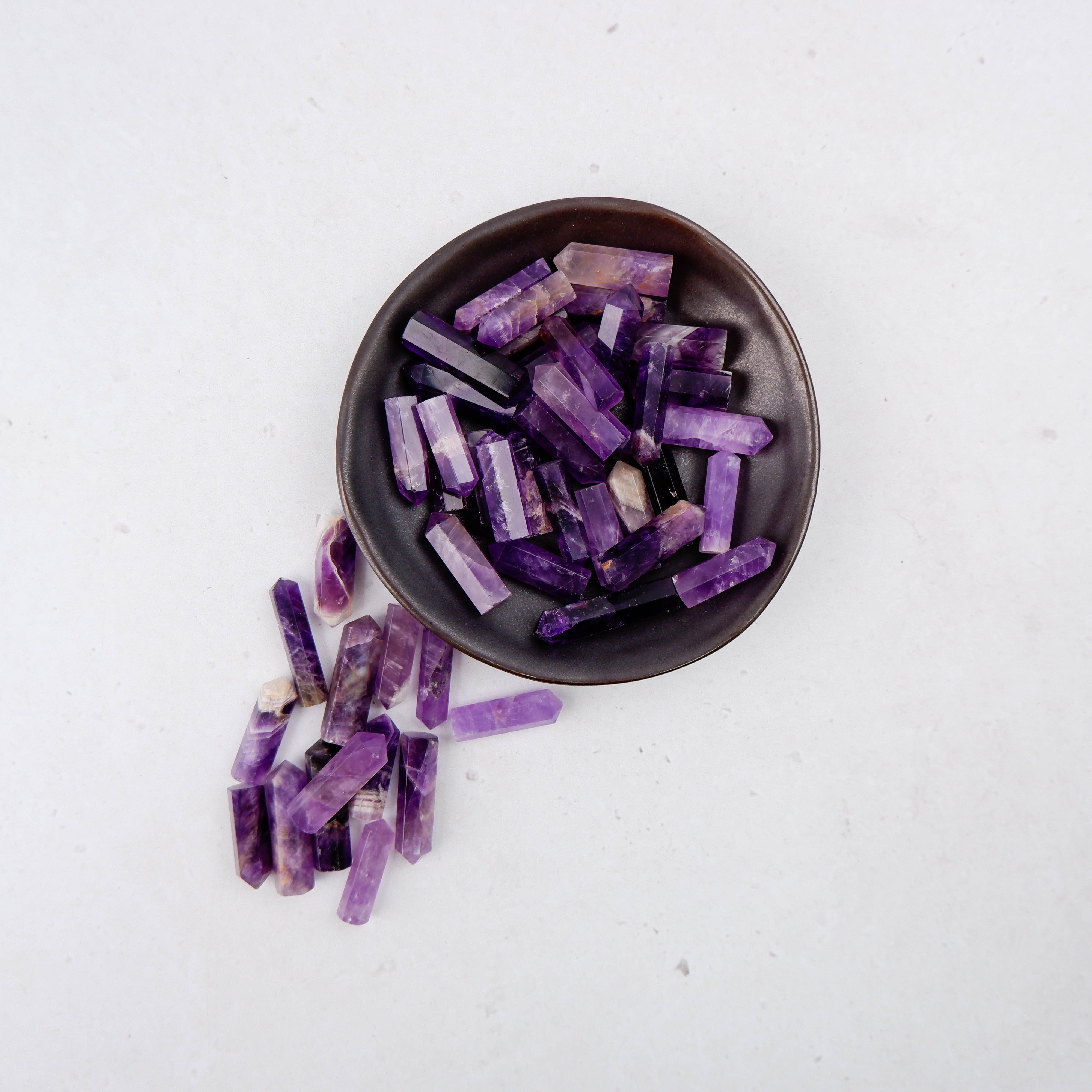 Amethyst single gridding point by Noctis Studio, featuring a polished purple gemstone for decorative or spiritual use.