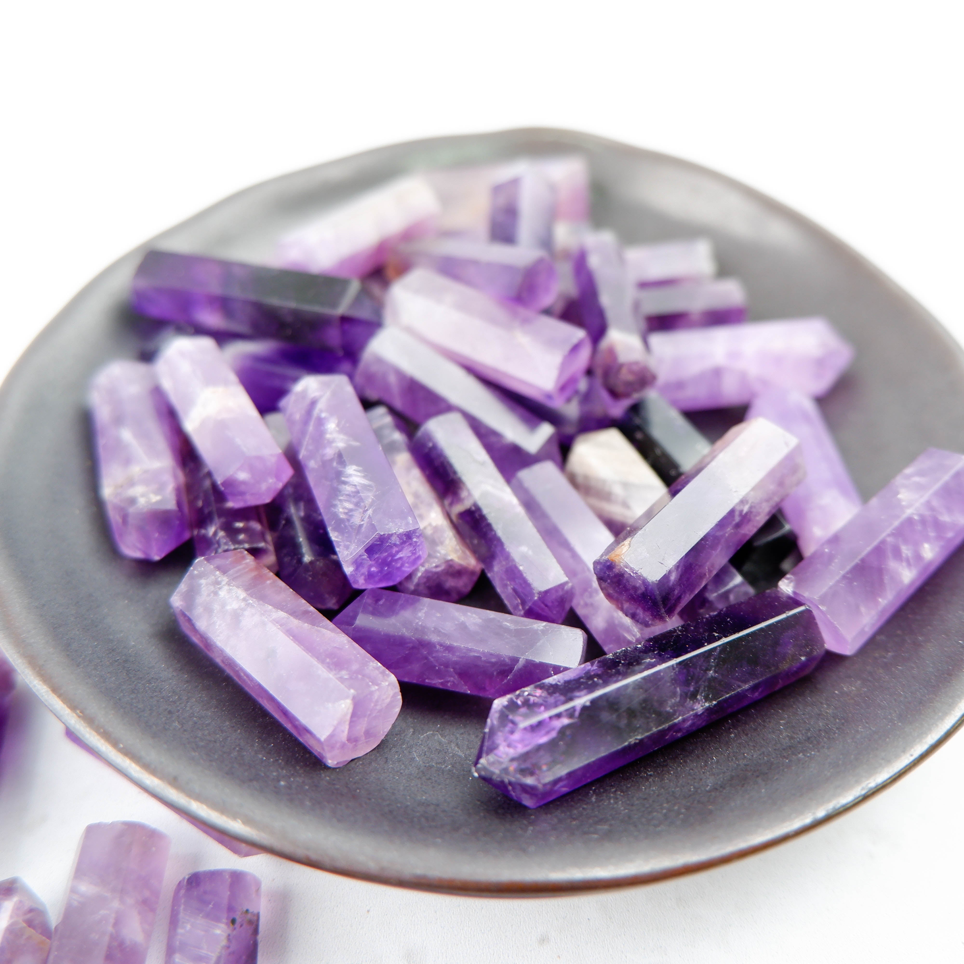 Noctis Studio amethyst single gridding point with polished, pointed crystal for gemstone crafting and jewelry making.