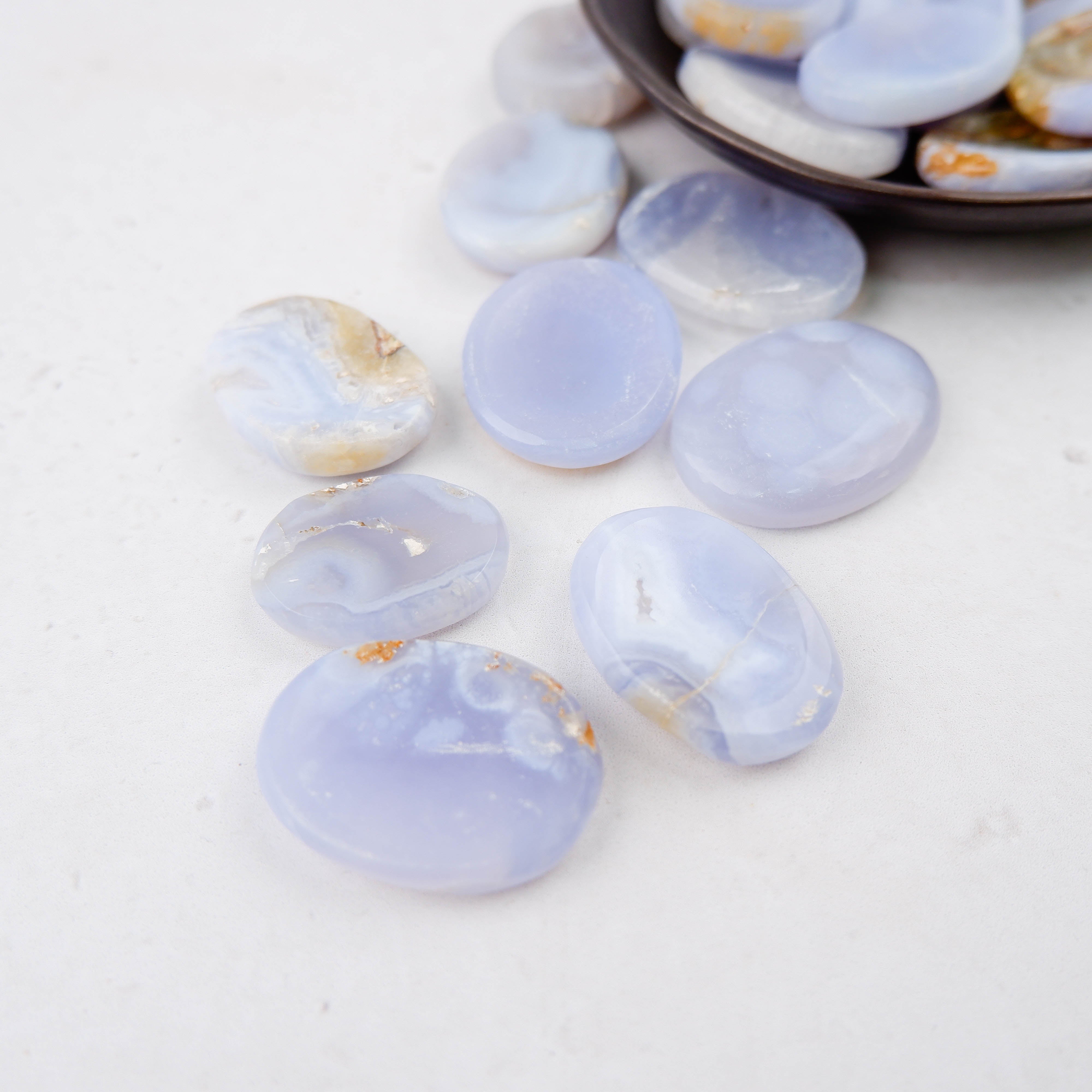 Blue Lace Agate worry stone from Noctis Studio, smooth polished gemstone with intricate blue and white lace-like patterns.