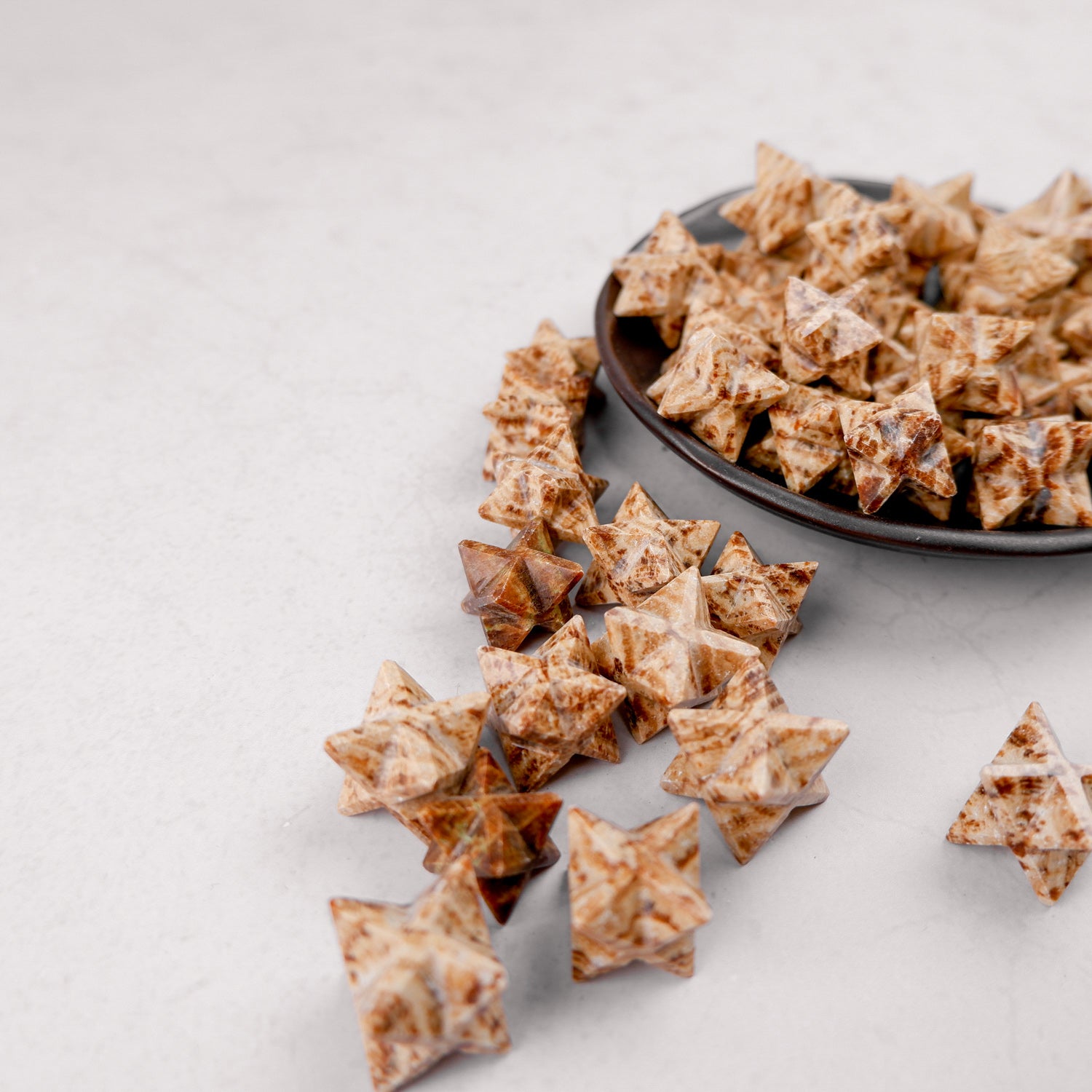 Noctis Studio Aragonite Star, natural mineral star-shaped specimen with earthy textures and warm tones.