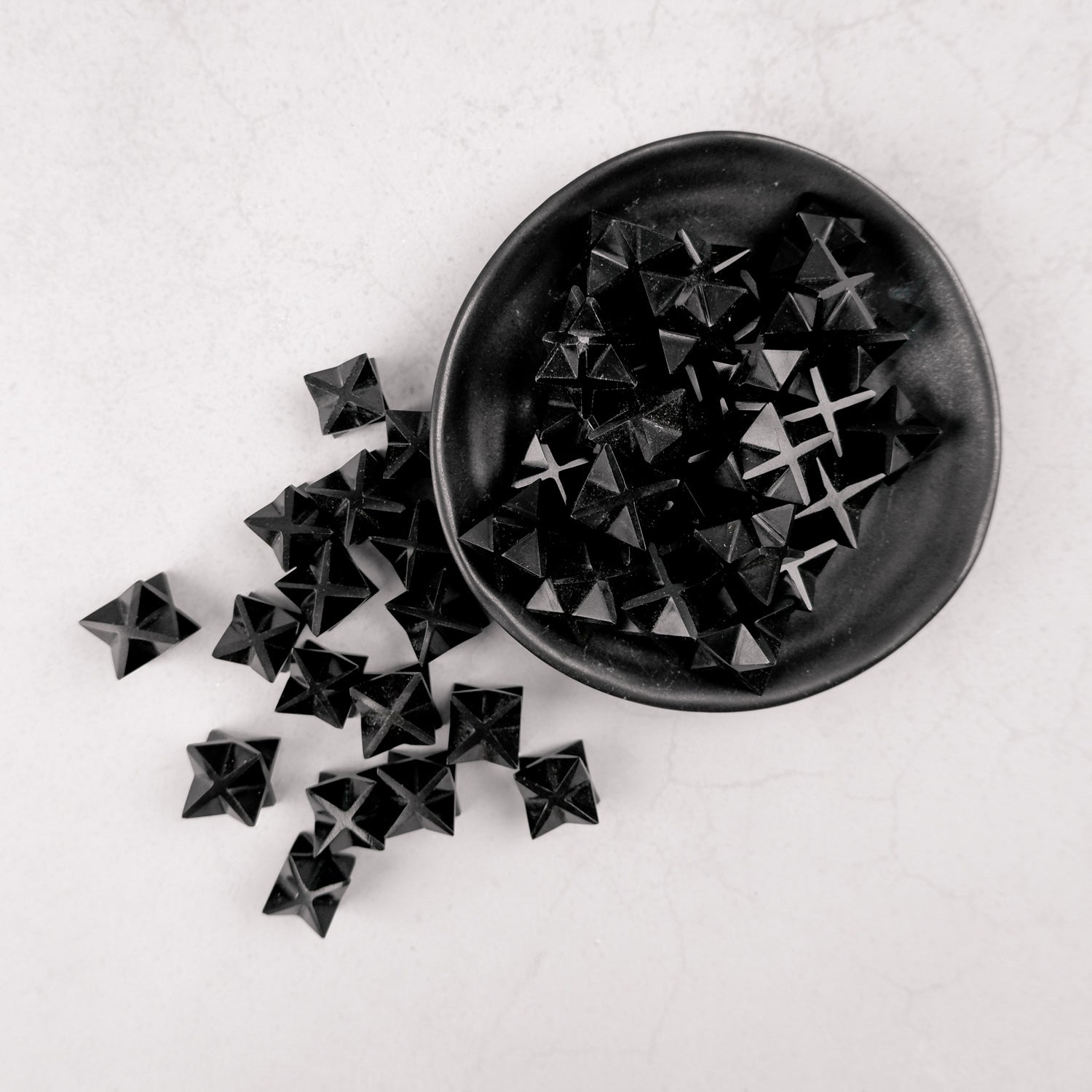 Noctis Studio Obsidian Star, a black star-shaped decorative ornament with a smooth, glossy finish.