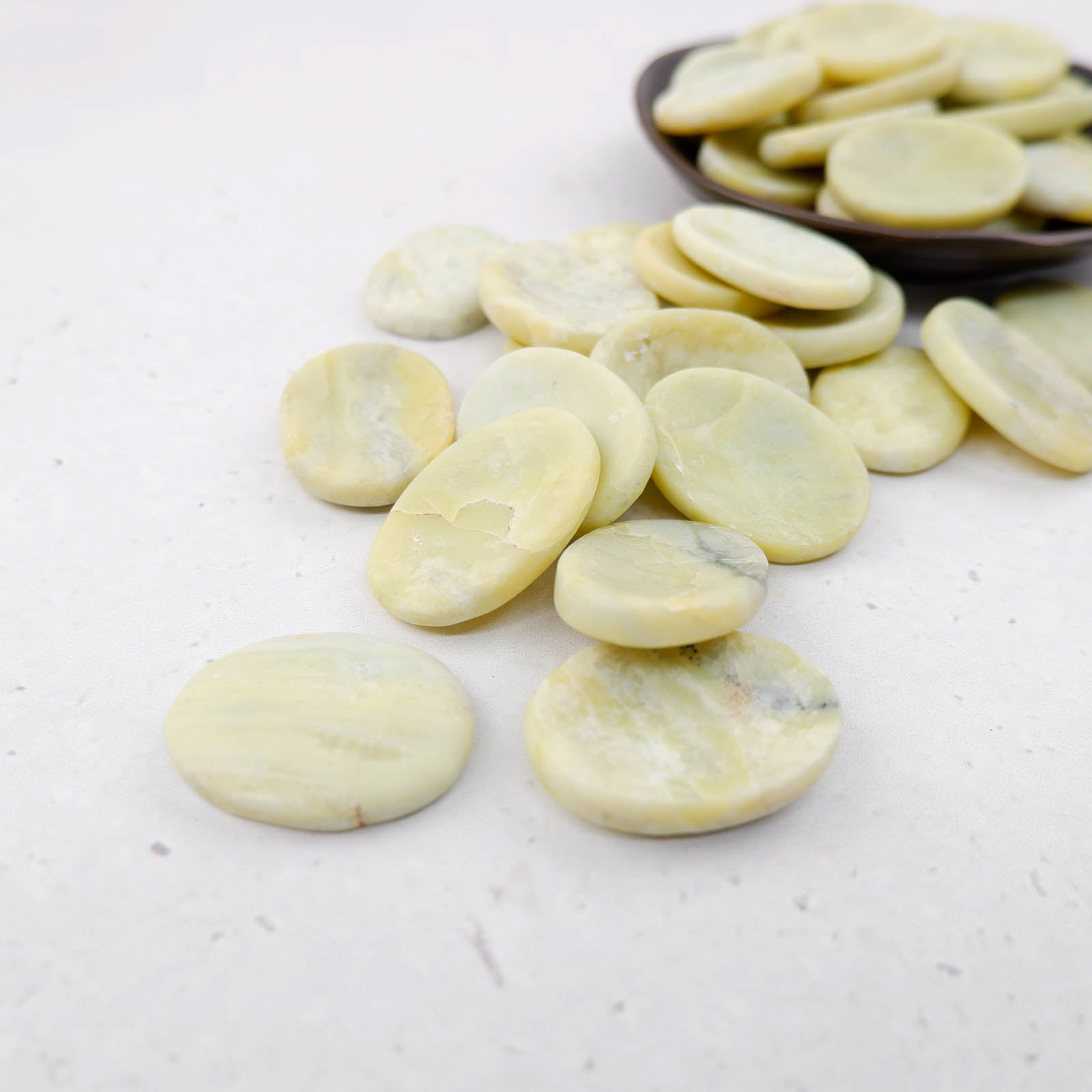 Serpentine worry stone from Noctis Studio, smooth polished gemstone for stress relief and tactile comfort.