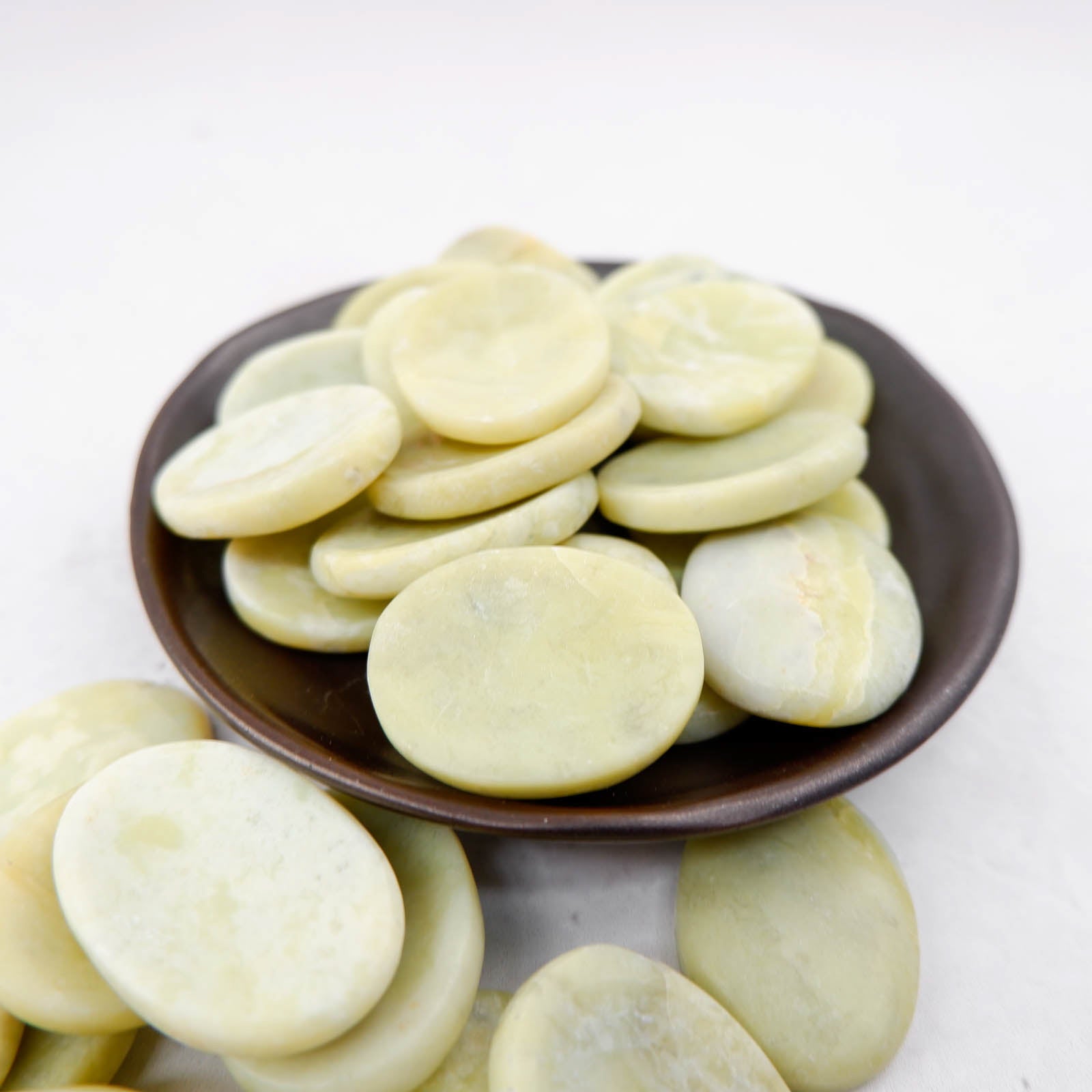 Serpentine worry stone from Noctis Studio with smooth, polished surface for stress relief and tactile comfort.