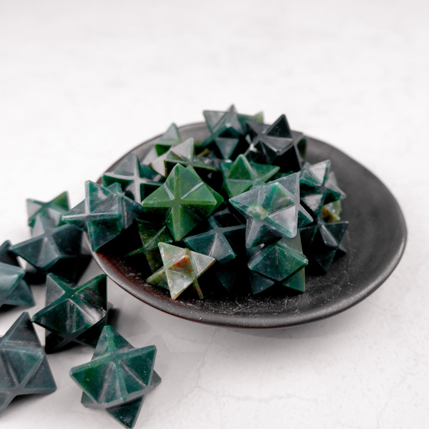 Bloodstone Star sculpture by Noctis Studio featuring a polished bloodstone star with intricate detailing.