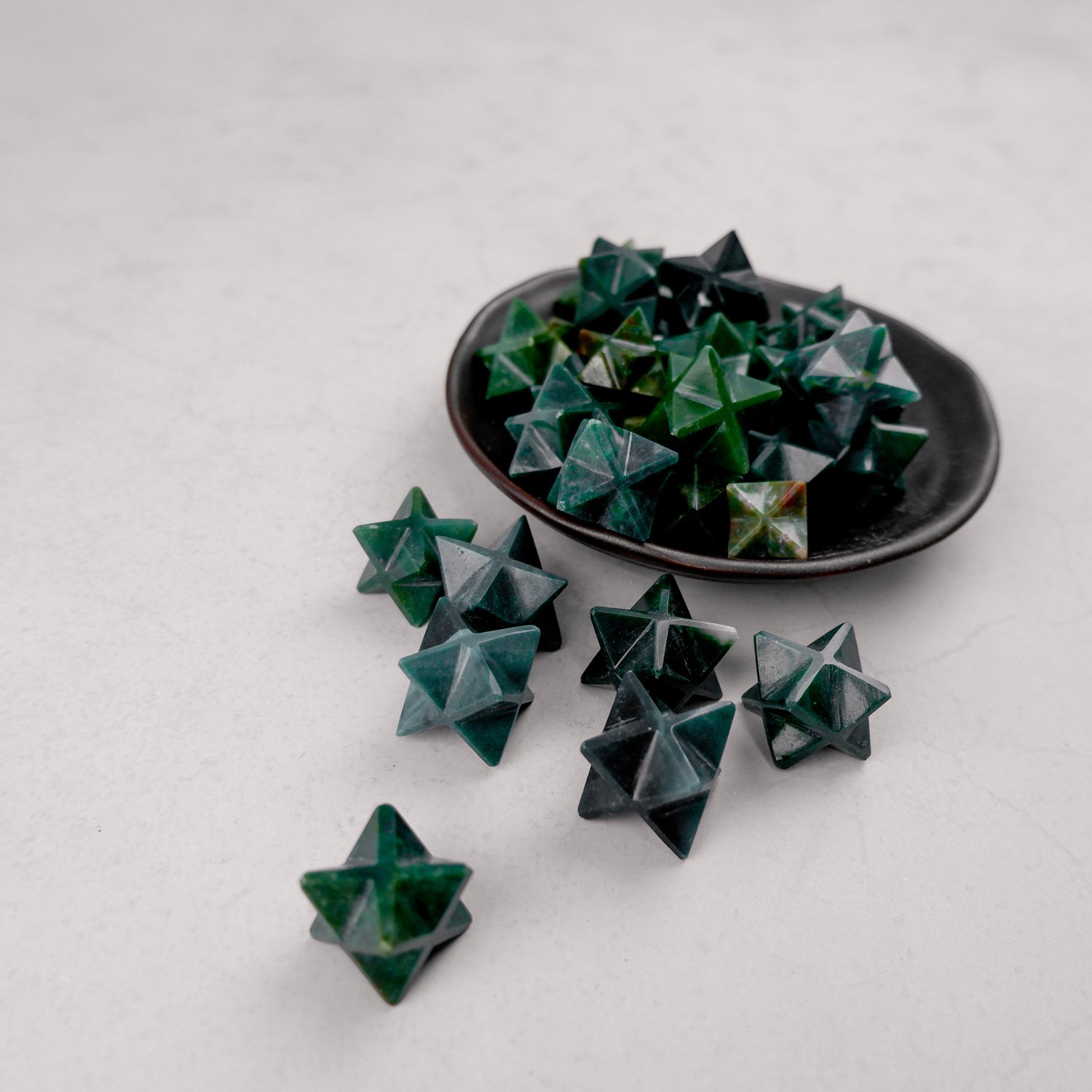 Bloodstone star pendant from Noctis Studio featuring a polished bloodstone gemstone in a star-shaped design.