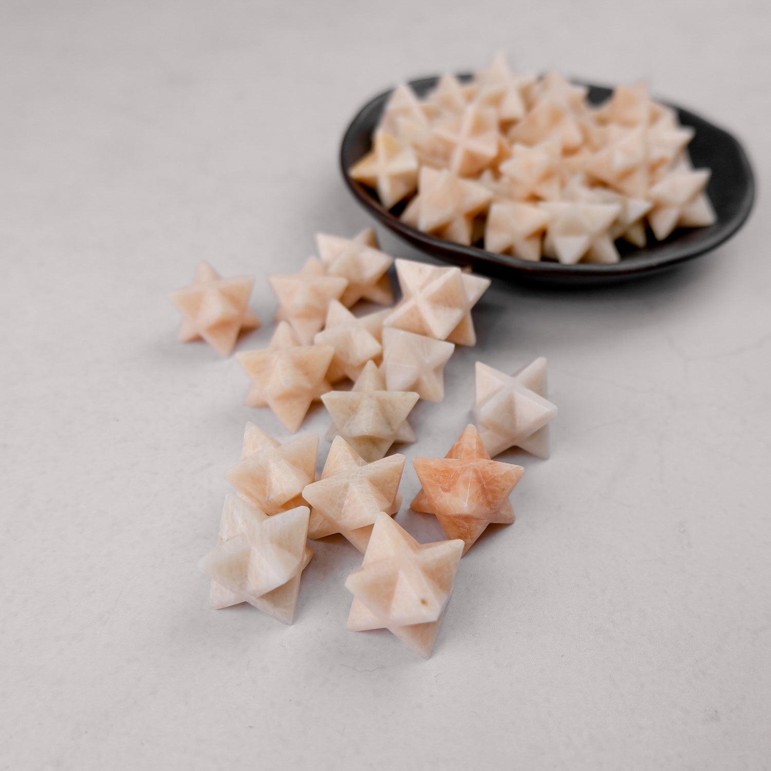 Cream moonstone star jewelry by Noctis Studio, featuring a polished star-shaped gemstone with soft shimmer and smooth surface.
