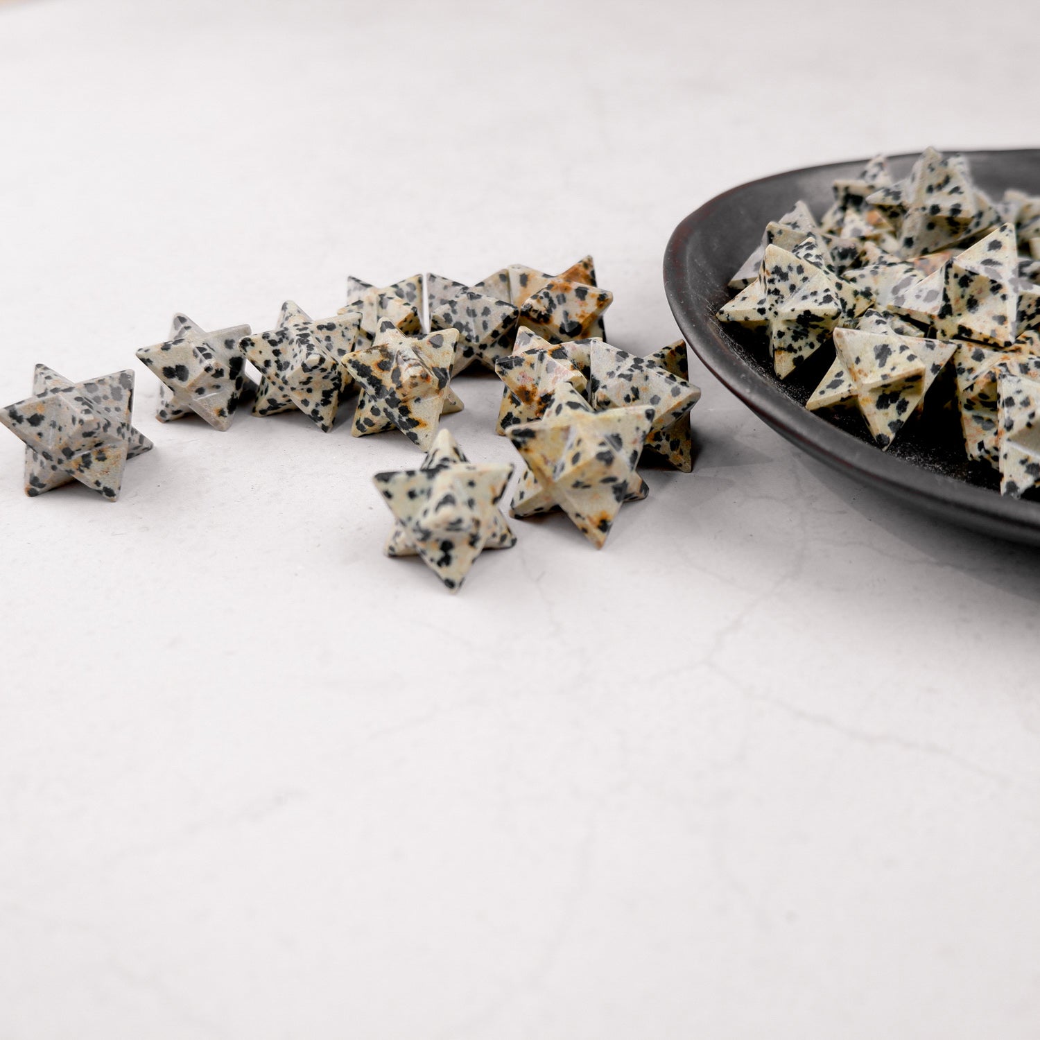 Dalmatian Star by Noctis Studio, a decorative star sculpture with a black and white spotted pattern, displayed against a neutral background.